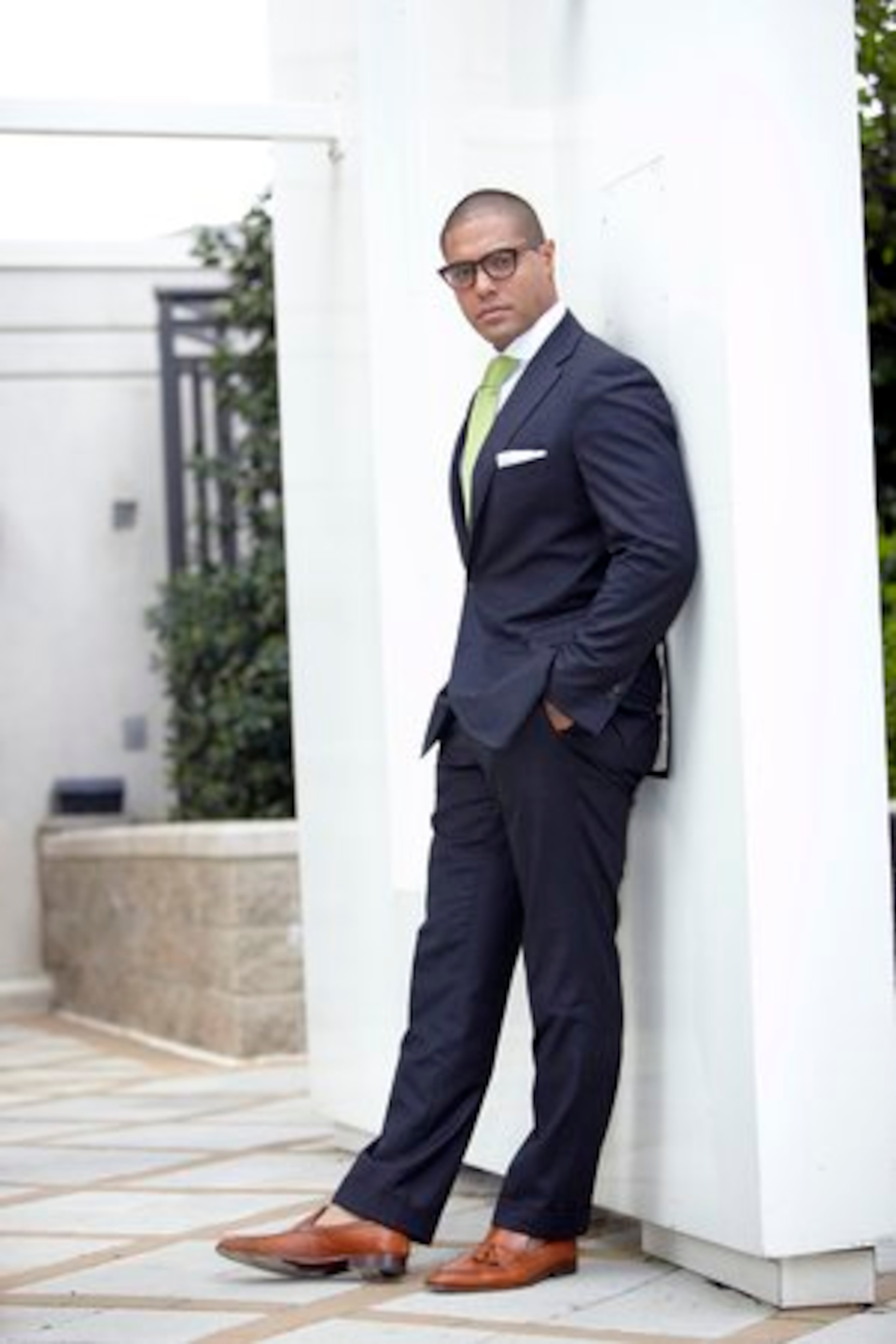SIGNATURE STYLE: "Eclectic elegance with a touch of Italy. I'm very strict in regards to details and fit. I think no matter what you do your style should reflect your personality." Ramos wears a fully custom made Astor & Black suit and tie with a pair of A. Testoni tassel loafers and Shuron Sidewinder glasses.