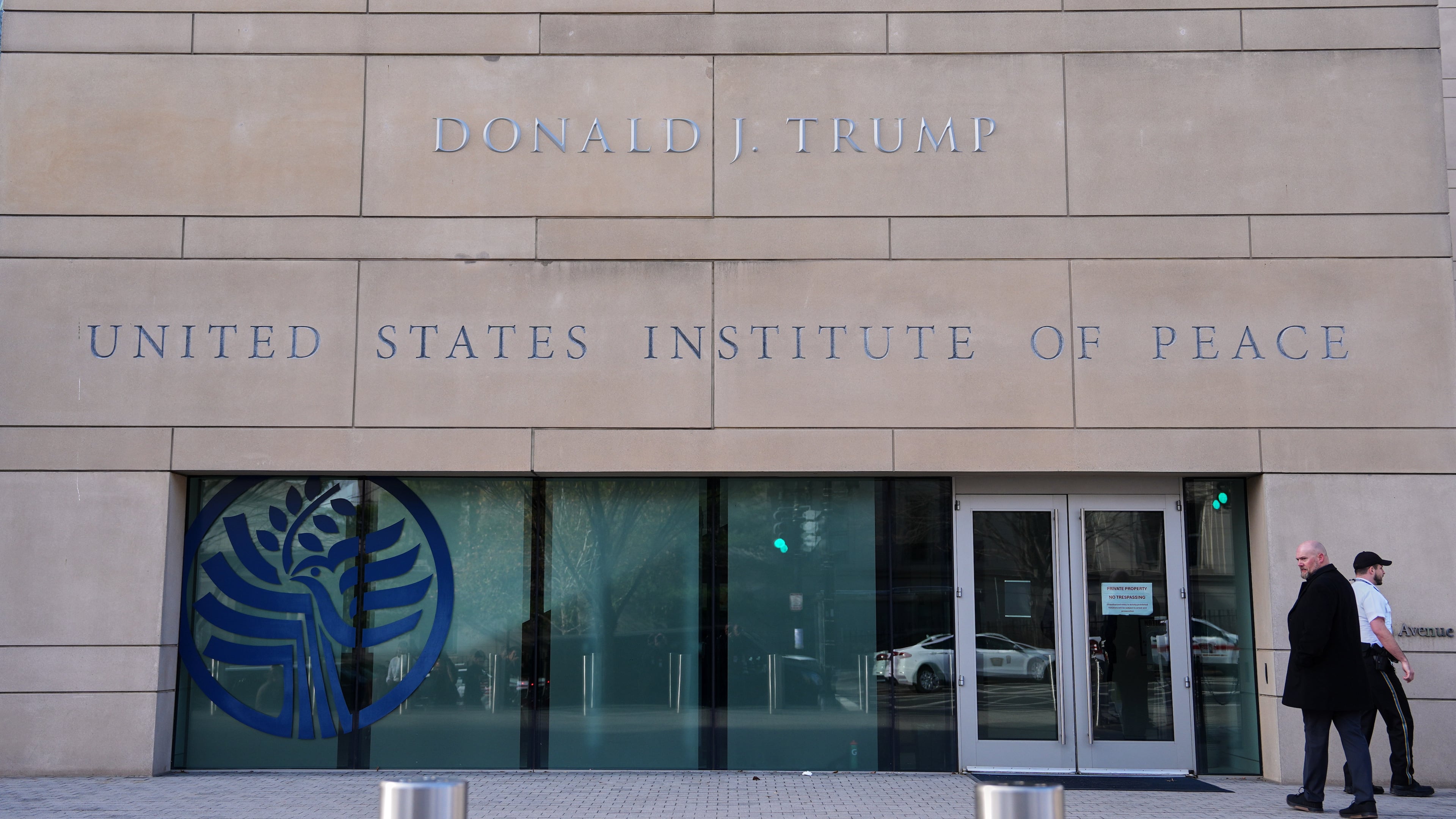 FILE - President Donald Trump's name is seen on the U.S. Institute of Peace building, Dec. 4, 2025, in Washington. (AP Photo/Evan Vucci, File)