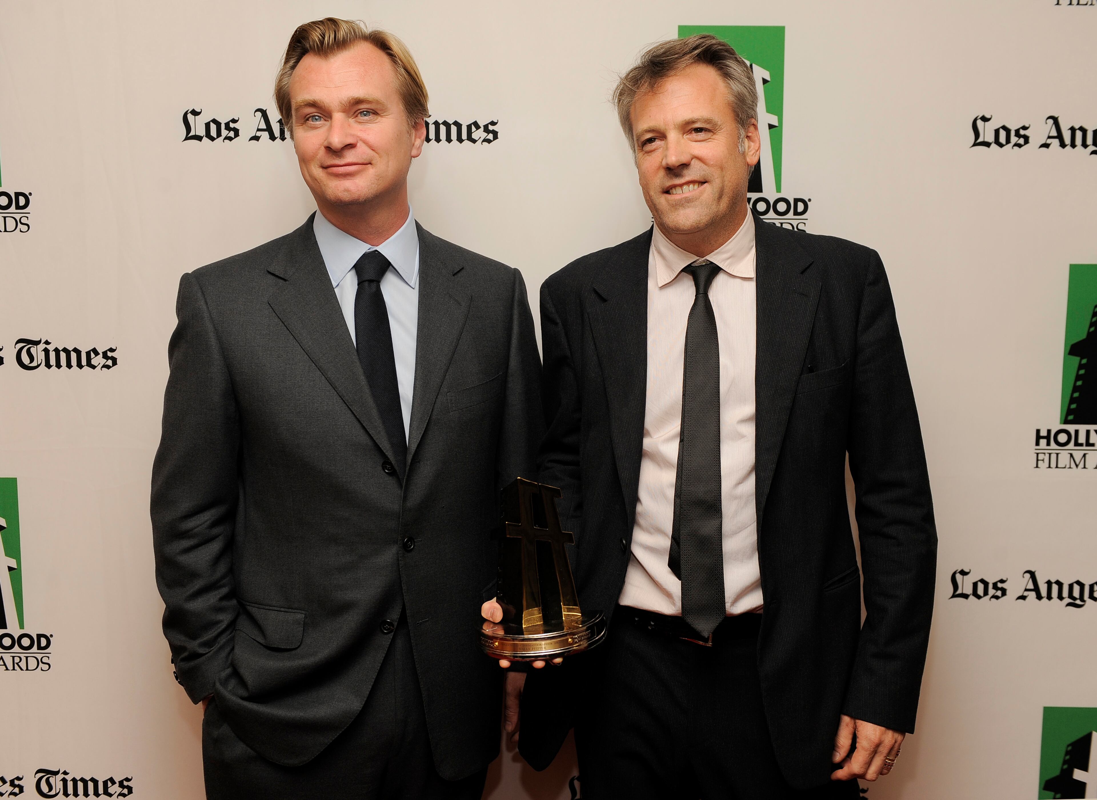 Wally Pfister, right, recipient of the Hollywood Cinematographer Award for the film "The Dark Knight Rises," poses with the film's director Christopher Nolan backstage at the 16th Annual Hollywood Film Awards Gala on Monday, Oct. 22, 2012, in Beverly Hills, Calif.