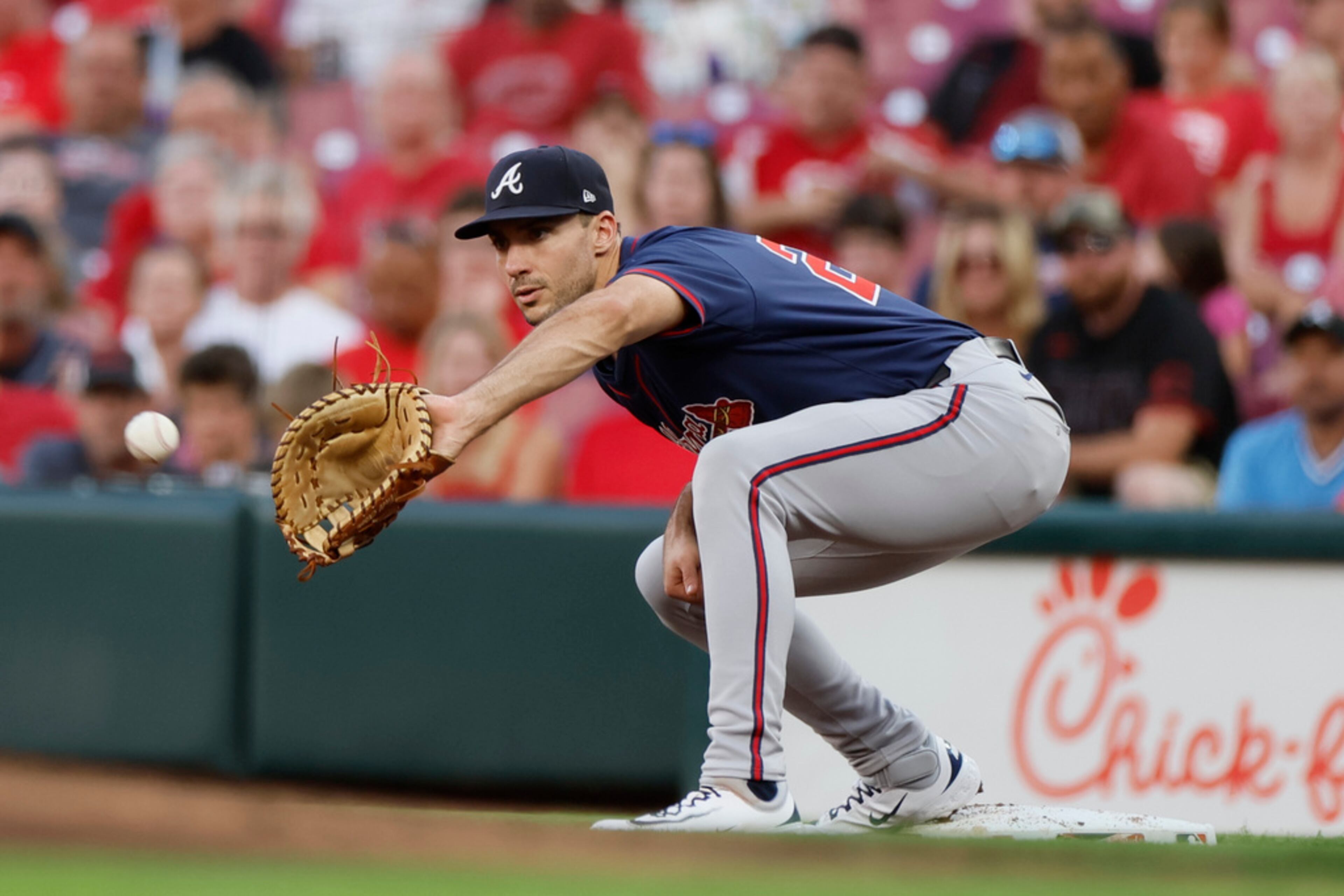 Atlanta Braves first baseman Matt Olson catches the ball to get Cincinnati Reds' Ty France out during the second inning of a baseball game, Wednesday, Sept. 18, 2024, in Cincinnati. (AP Photo/Jay LaPrete)