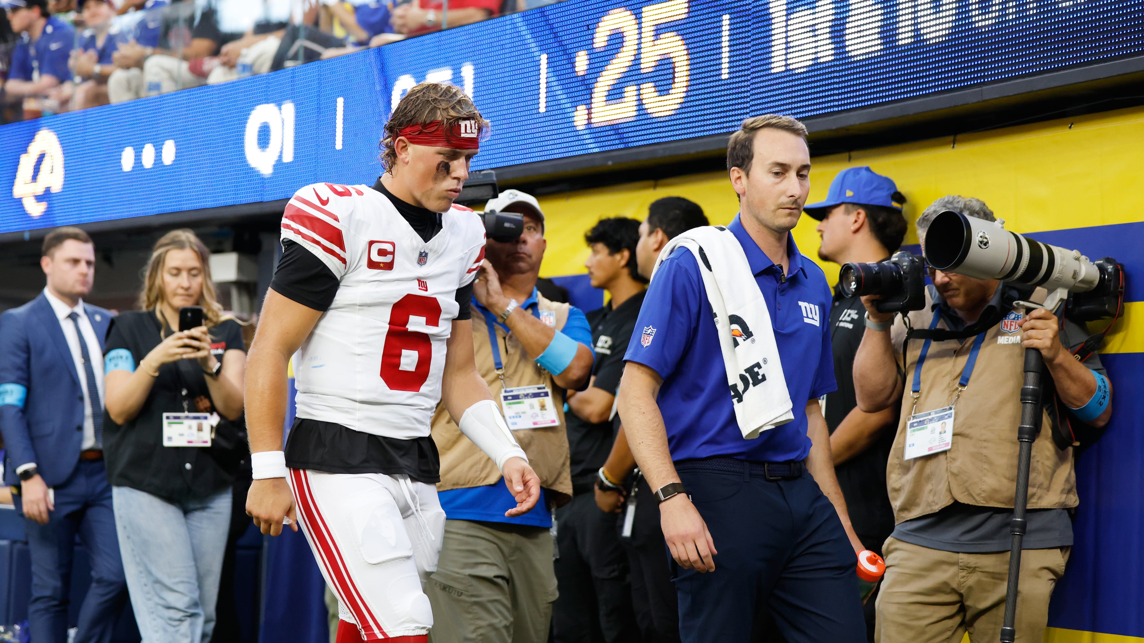New York Giants quarterback Jaxson Dart (6) walks off the field with an injury during the first half of an NFL football game against the Los Angeles Rams in Inglewood, Calif., Monday, Sept. 21, 2026. (AP Photo/Caroline Brehman)