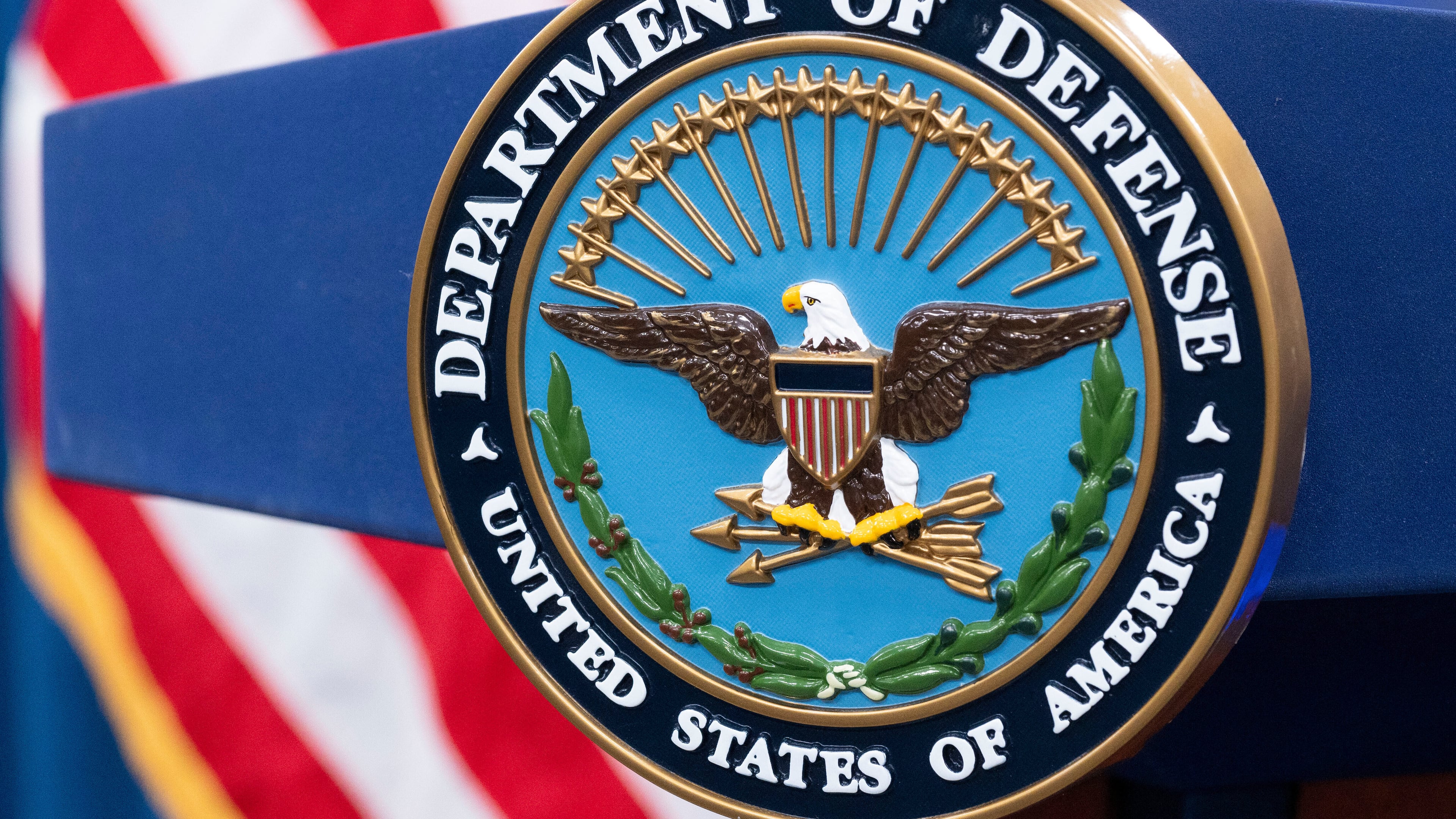 FILE - The Department of Defense seal is seen on the podium in the Press Briefing room at the Pentagon, Oct. 29, 2024, in Washington. (AP Photo/Kevin Wolf, File)