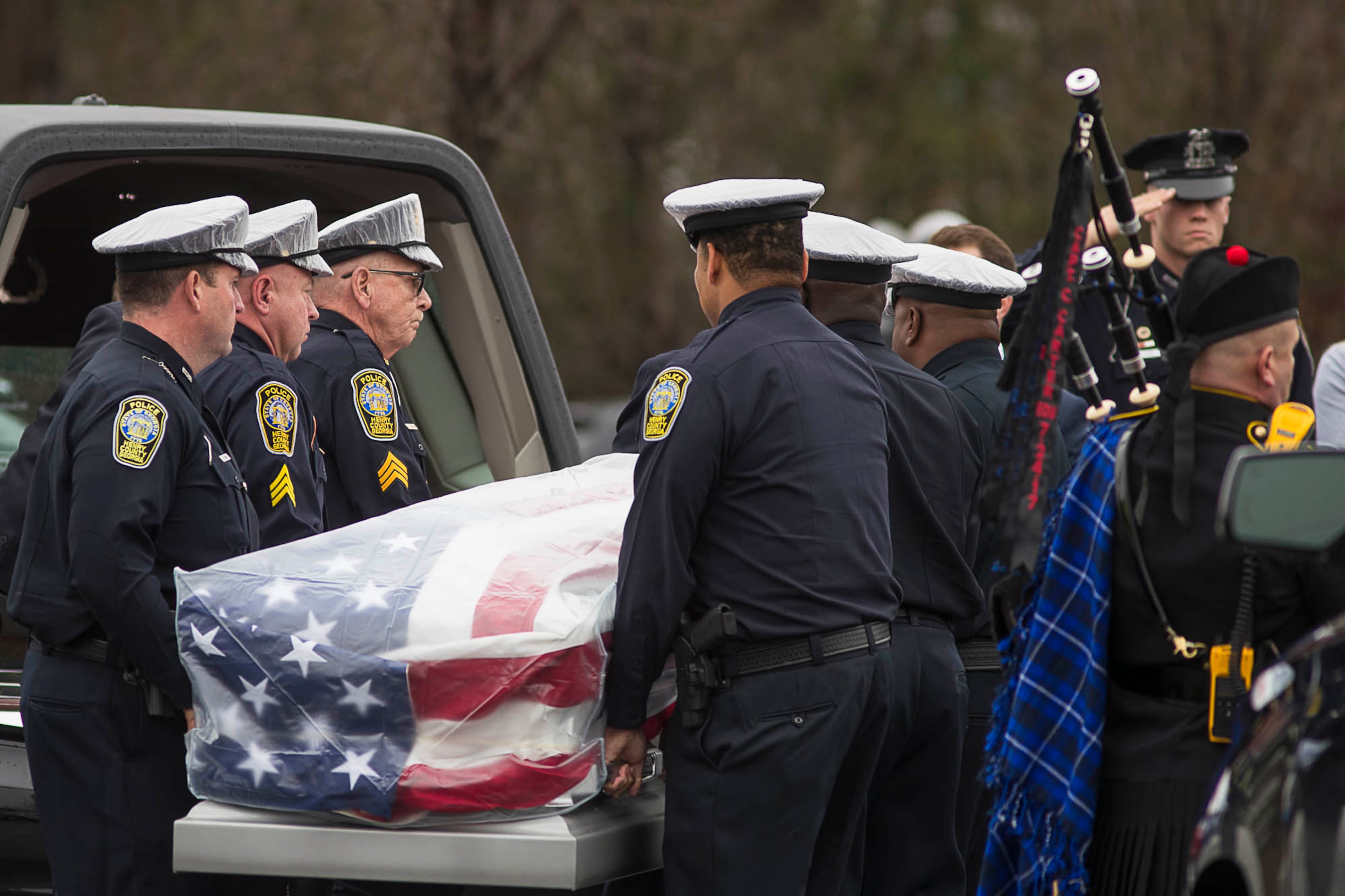 01/03/2019 -- McDonough, Georgia -- The casket of Henry County Police Officer Michael Smith is carried into Glen Haven Baptist Church in McDonough, Thursday, January 3, 2019. Henry County police Officer Michael Smith Smith, 33, was shot Dec. 6 while responding to a report of an irate man at a McDonough-area dental office. According to investigators, a single shot struck and killed that man and critically injured Smith. He survived the initial shooting and was recovering. But three weeks later, Smith died from his injuries. (ALYSSA POINTER/ALYSSA.POINTER@AJC.COM)