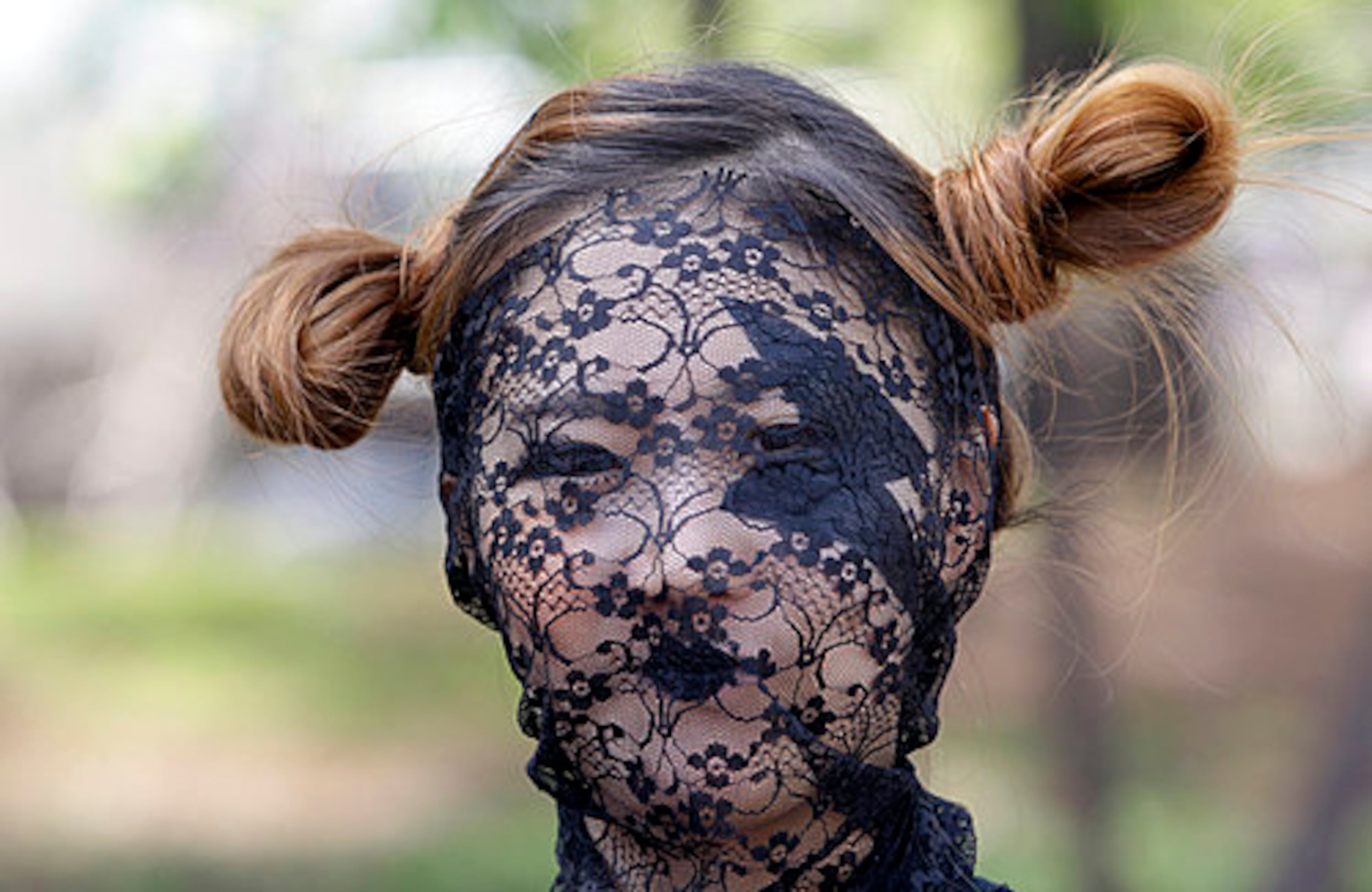 A fan dressed up as US pop diva Lady Gaga waits for Gaga's concert in front of the venue in Seoul, South Korea, Friday, April 27, 2012.