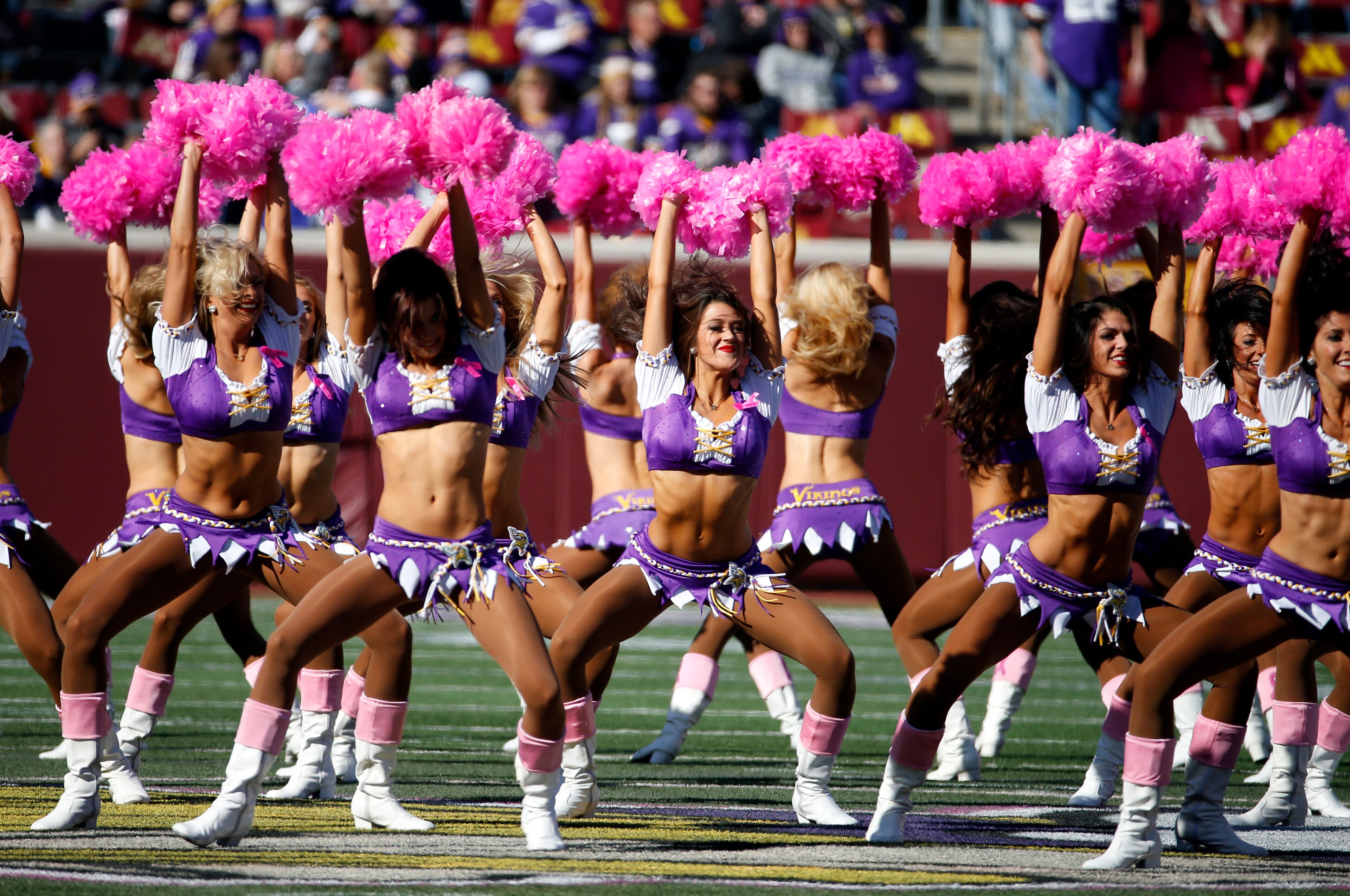 The Minnesota Vikings cheerleaders perform with pink pom-poms for breast cancer awareness during the first half of an NFL football game against the Kansas City Chiefs, Sunday, Oct. 18, 2015, in Minneapolis. (AP Photo/Ann Heisenfelt)