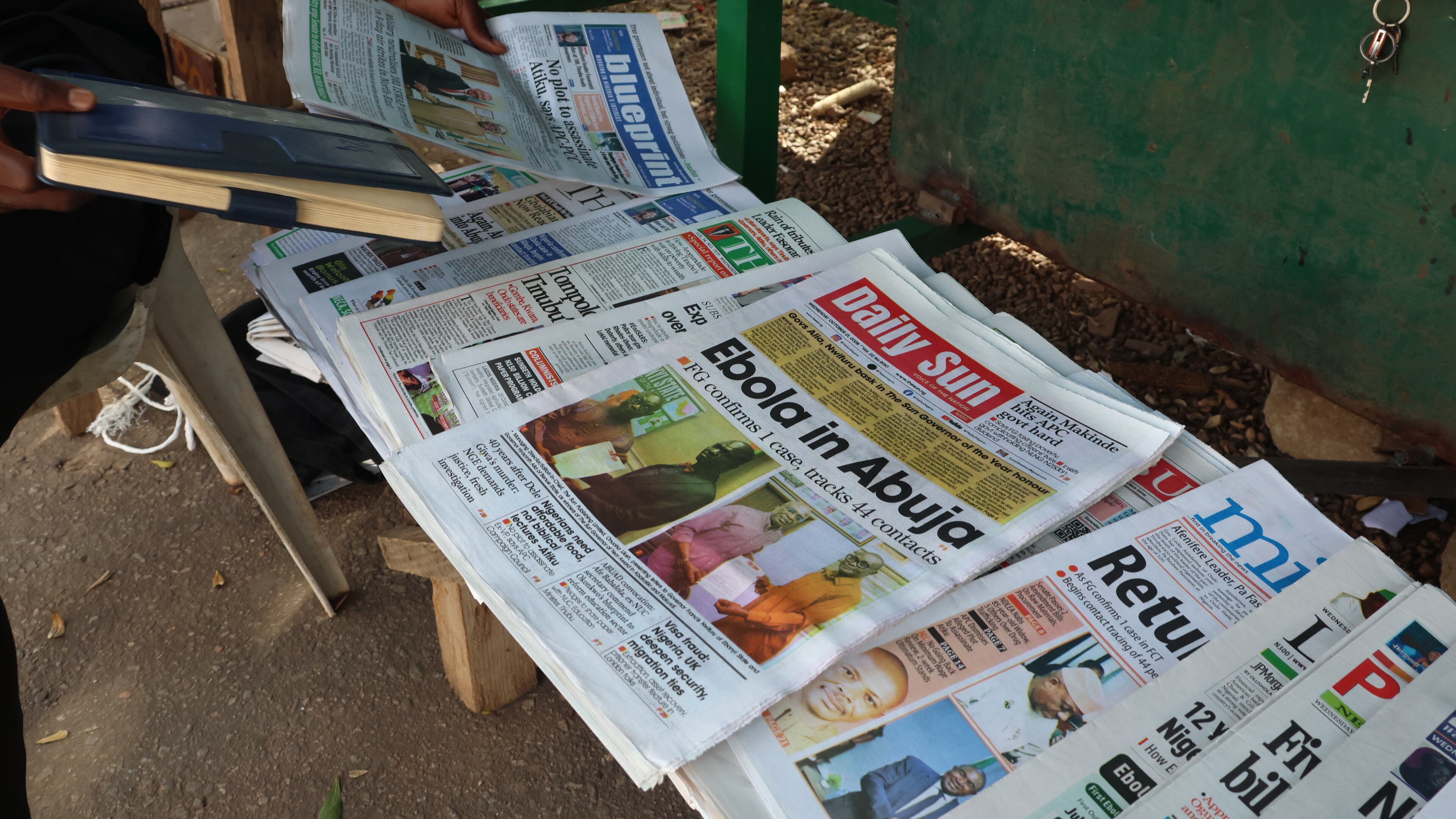 A man sells newspapers in Abuja, Nigeria Wednesday, Oct. 21, 2026. (AP Photo/Afolabi Sotunde)