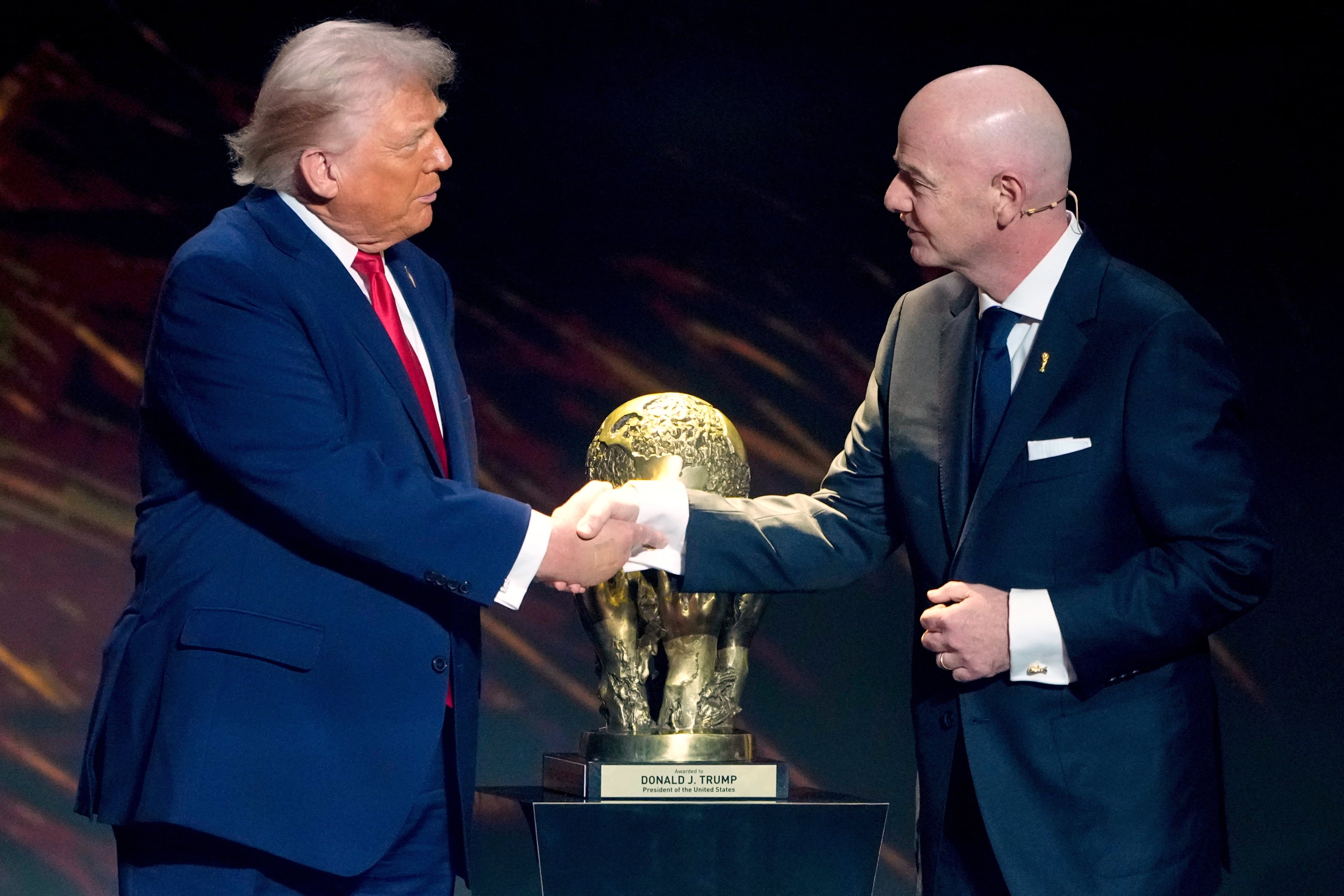 Two friends: FIFA President Gianni Infantino awards President Donald Trump with the newly invented FIFA Peace Prize in 2025. (Chris Carlson/AP)