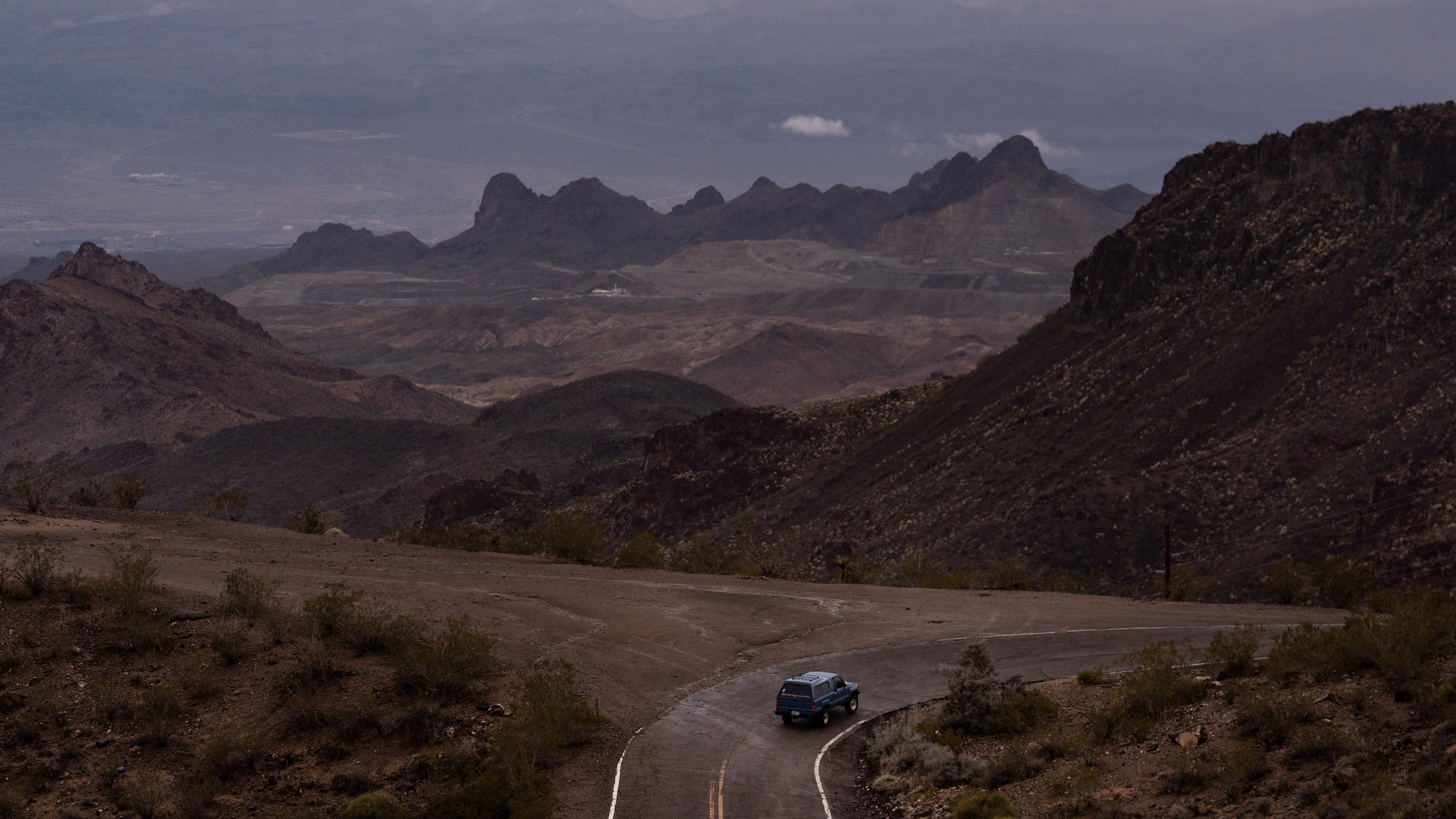 FILE - A car drives along Oatman Highway on historic Route 66, near Oatman, Ariz., on Friday, Nov. 21, 2025. (AP Photo/Jae C. Hong, File)