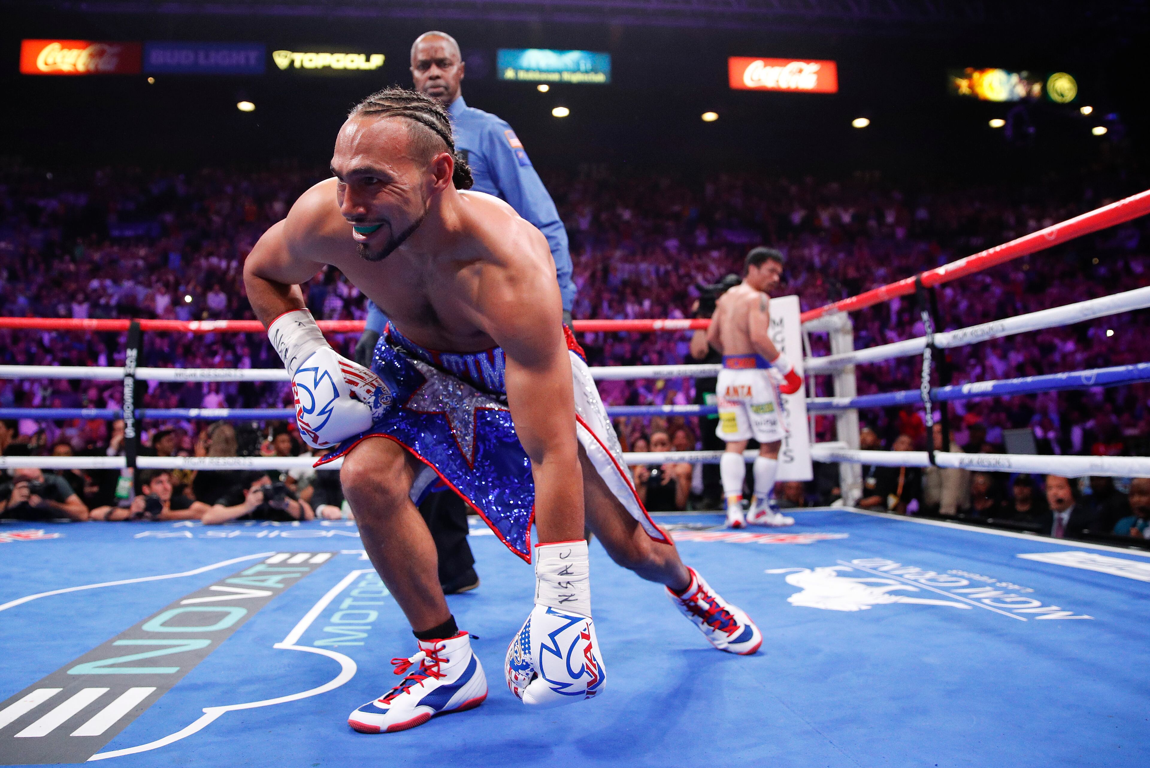 Keith Thurman gets up after being knocked down by Manny Pacquiao in the first round during a welterweight title fight Saturday, July 20, 2019, in Las Vegas. (AP Photo/John Locher)