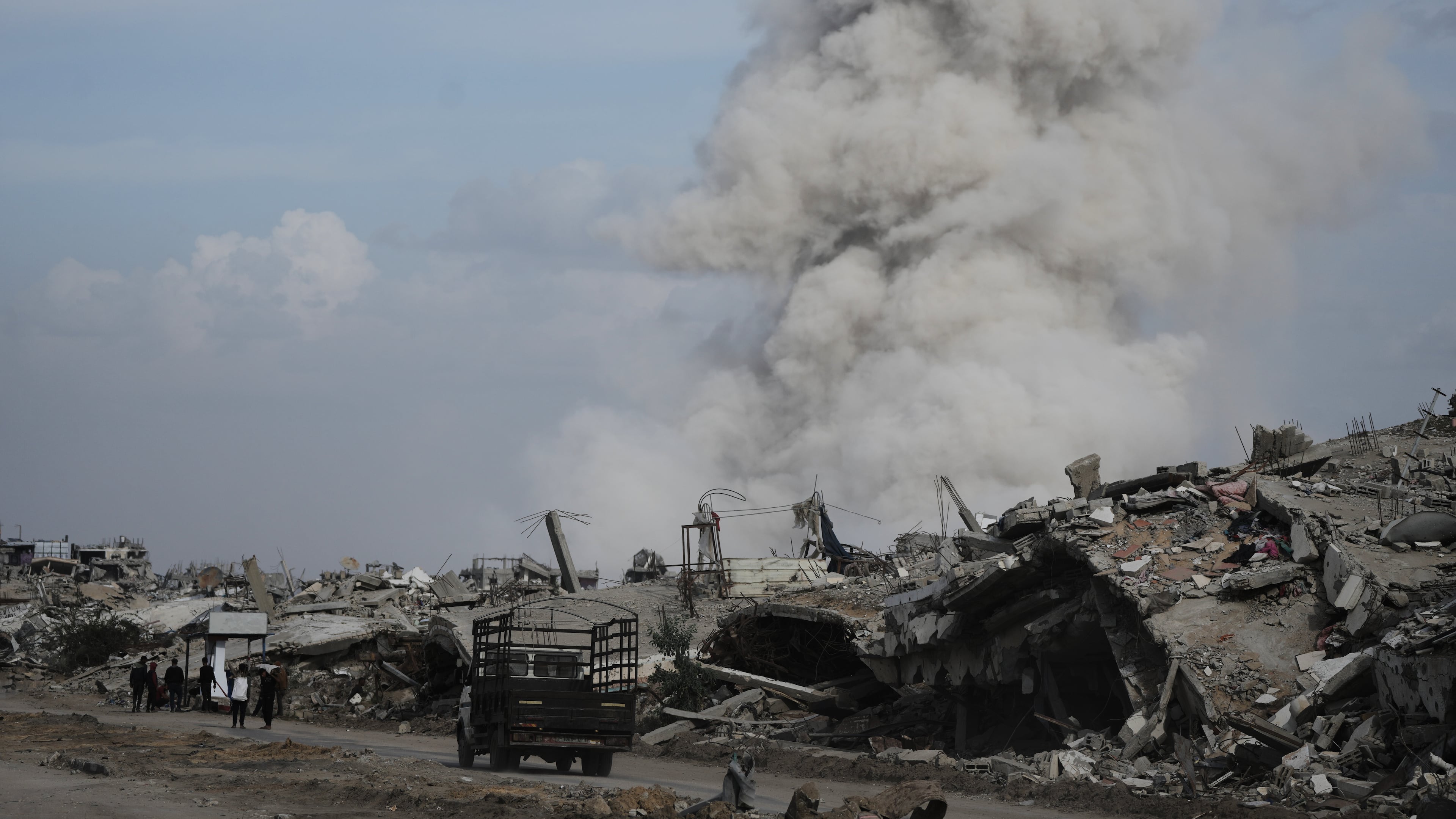 Smoke rises as Israeli military demolish a house east of Gaza City, Tuesday, Dec. 9, 2025. (AP Photo/Jehad Alshrafi)