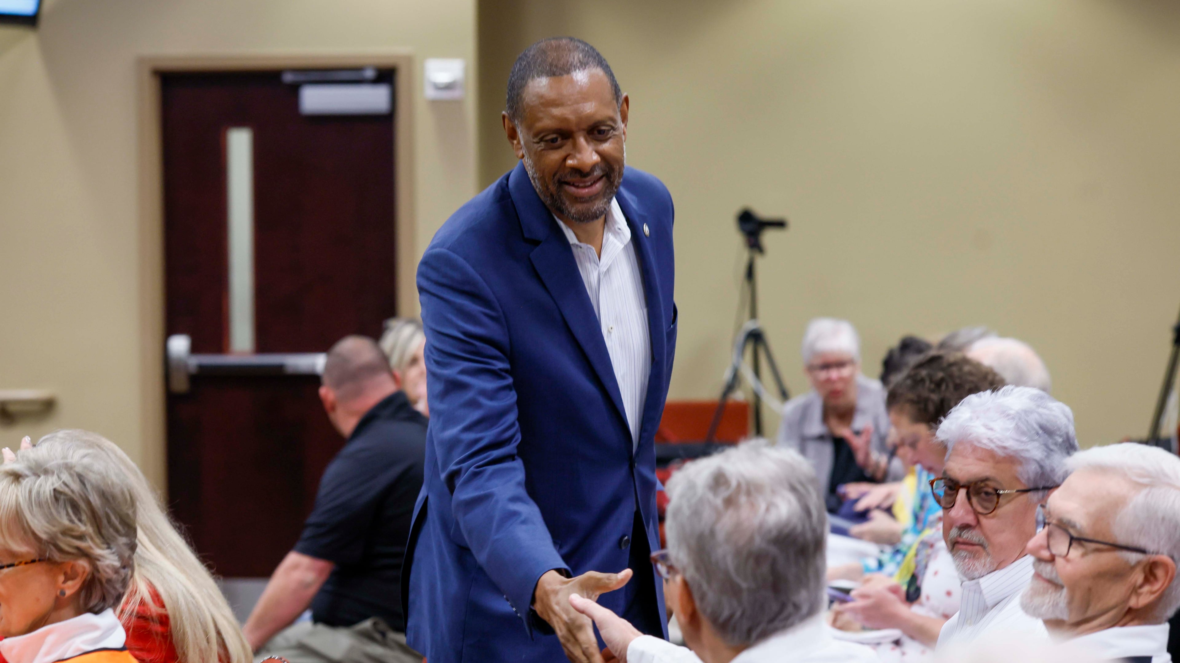 Secretary of state candidate Vernon Jones greets attendees at a State Election Board meeting held at the Dawson County Government Center on Wednesday, April 15, 2026. (Miguel Martinez/AJC)