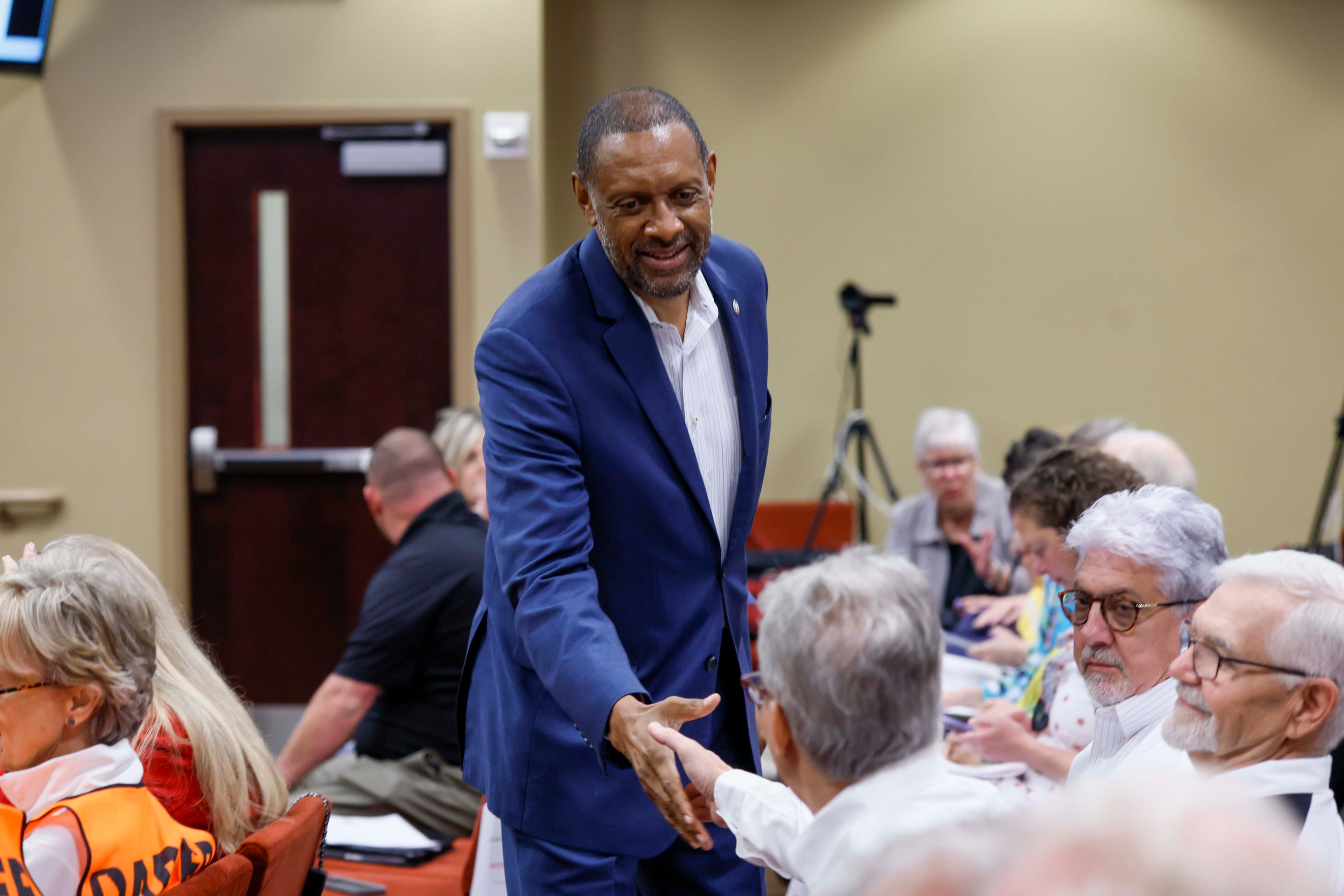 Secretary of state candidate Vernon Jones greets attendees at a State Election Board meeting held at the Dawson County Government Center on Wednesday, April 15, 2026. (Miguel Martinez/AJC)