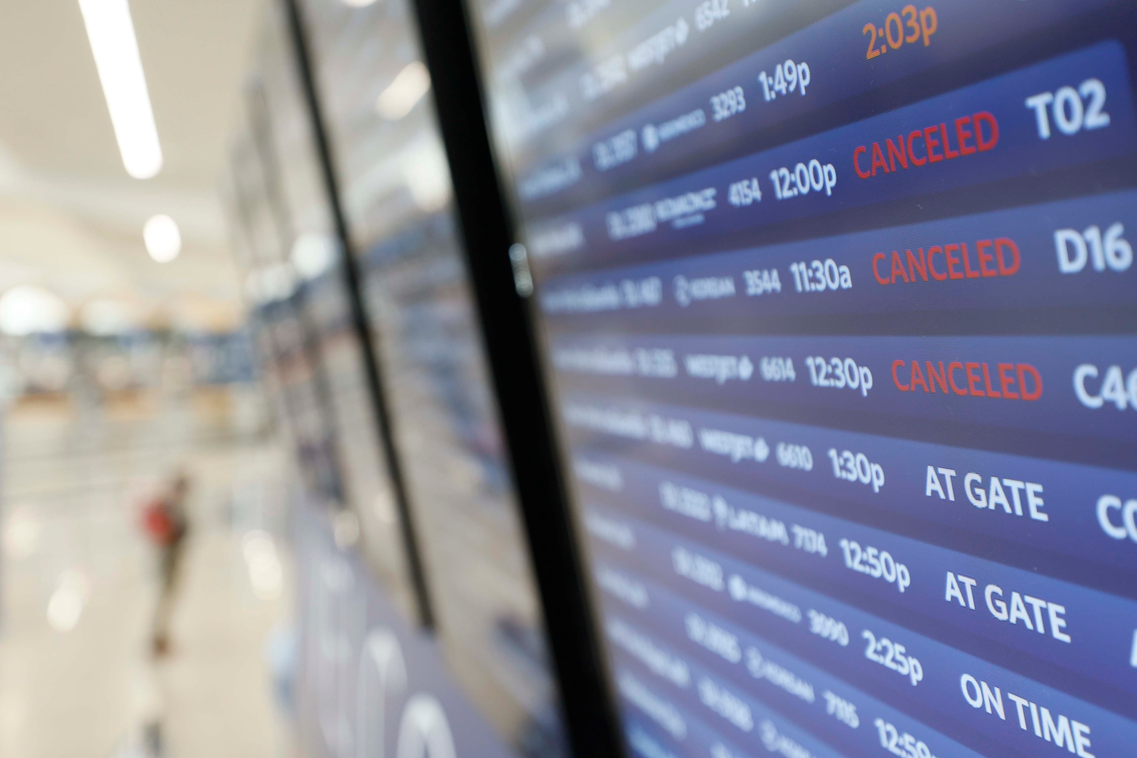 Screens show flight cancellations at Hartsfield-Jackson Atlanta International Airport on Monday, Jan. 26, 2026. (Miguel Martinez/AJC)