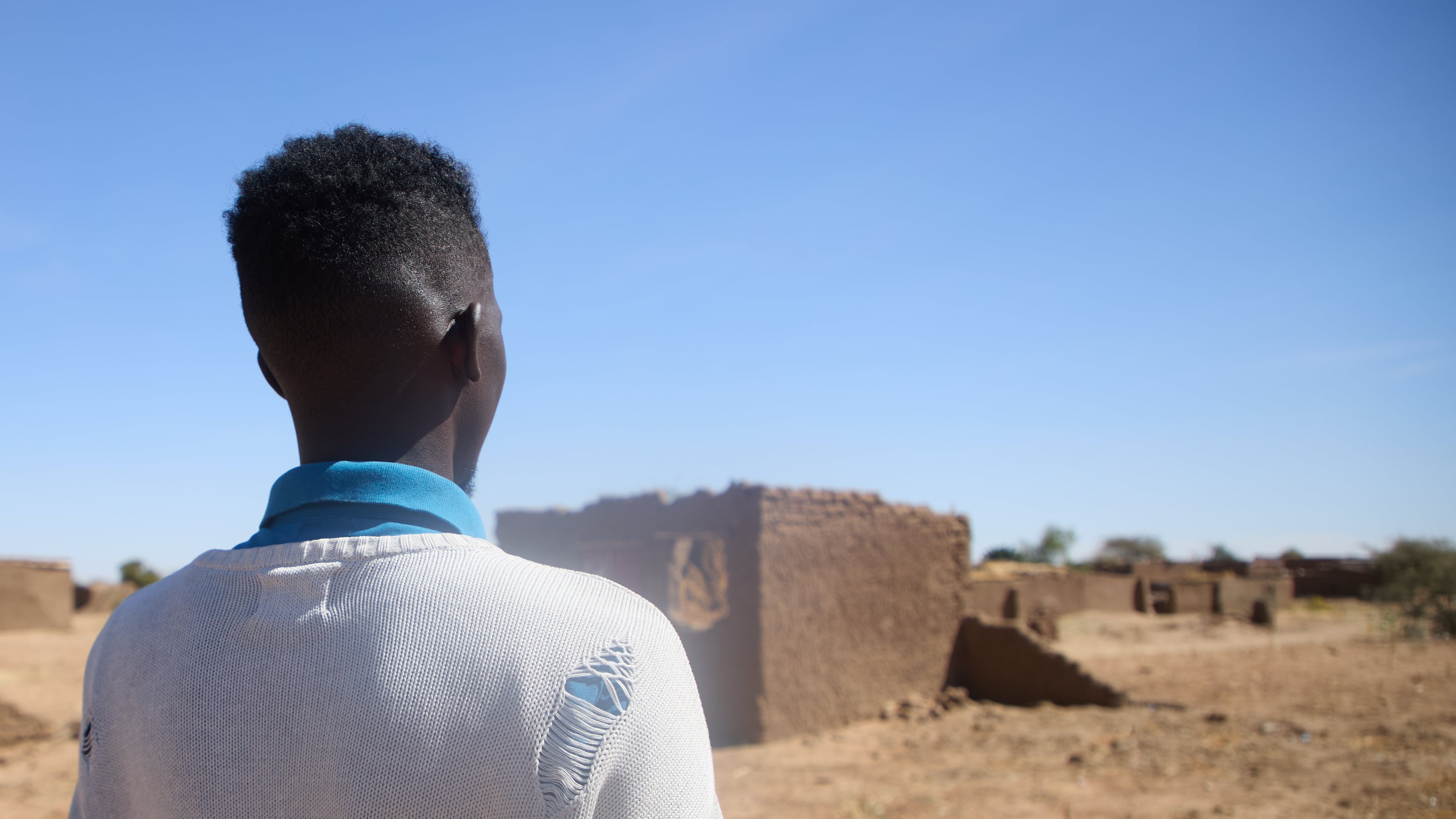 Dr. Mohamed Ibrahim, who asked that his face not be shown, walks at the Rwanda refugee camp in Darfur, Sudan, Dec. 22, 2025. (AP Photo/Marwan Mohamed) (AP Photo/Marwan Mohamed)