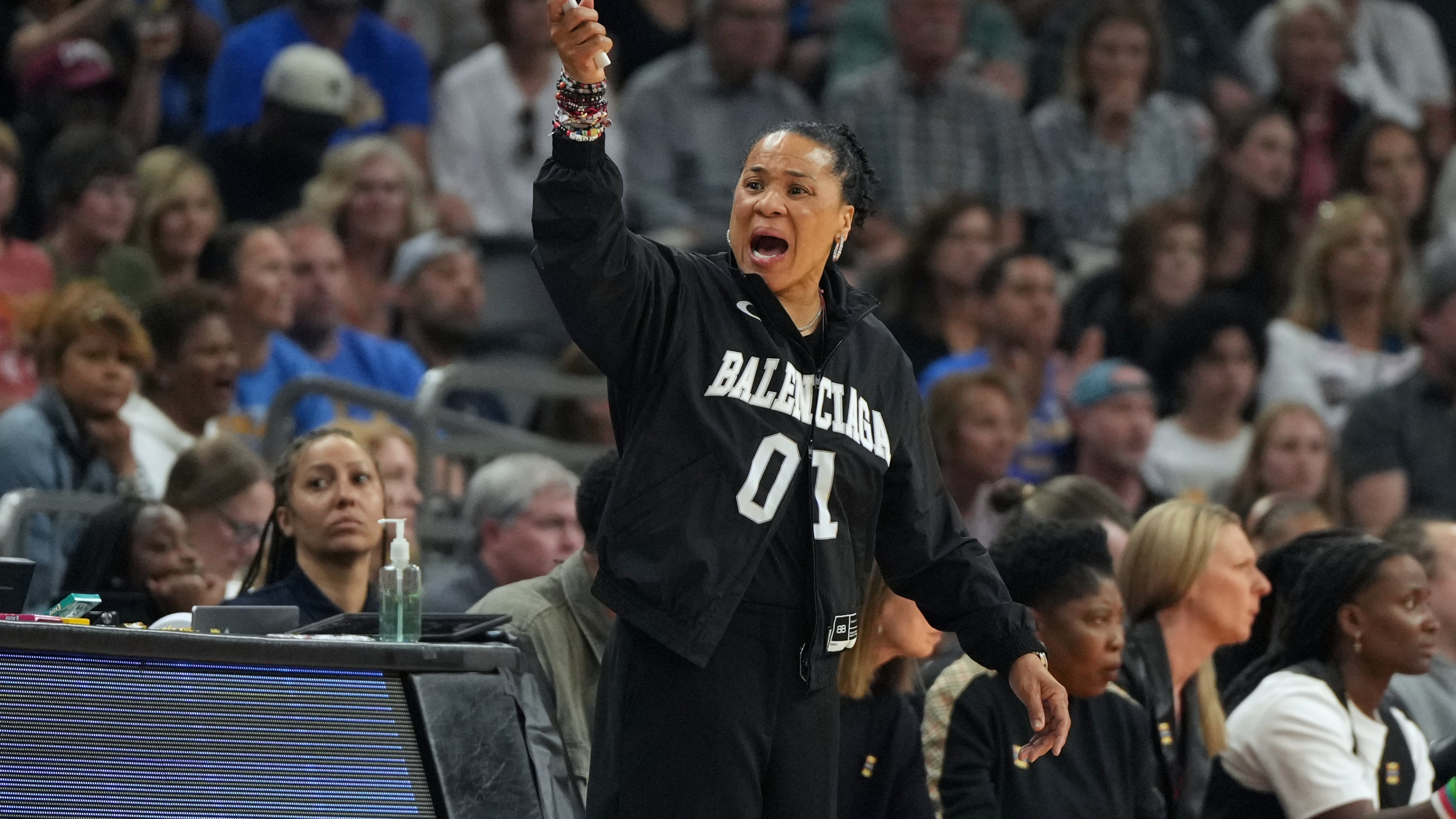 South Carolina head coach Dawn Staley motions towards the court during the first half of the women's National Championship Final Four NCAA college basketball tournament game against UCLA, Sunday, April 5, 2026, in Phoenix. (AP Photo/Rick Scuteri)