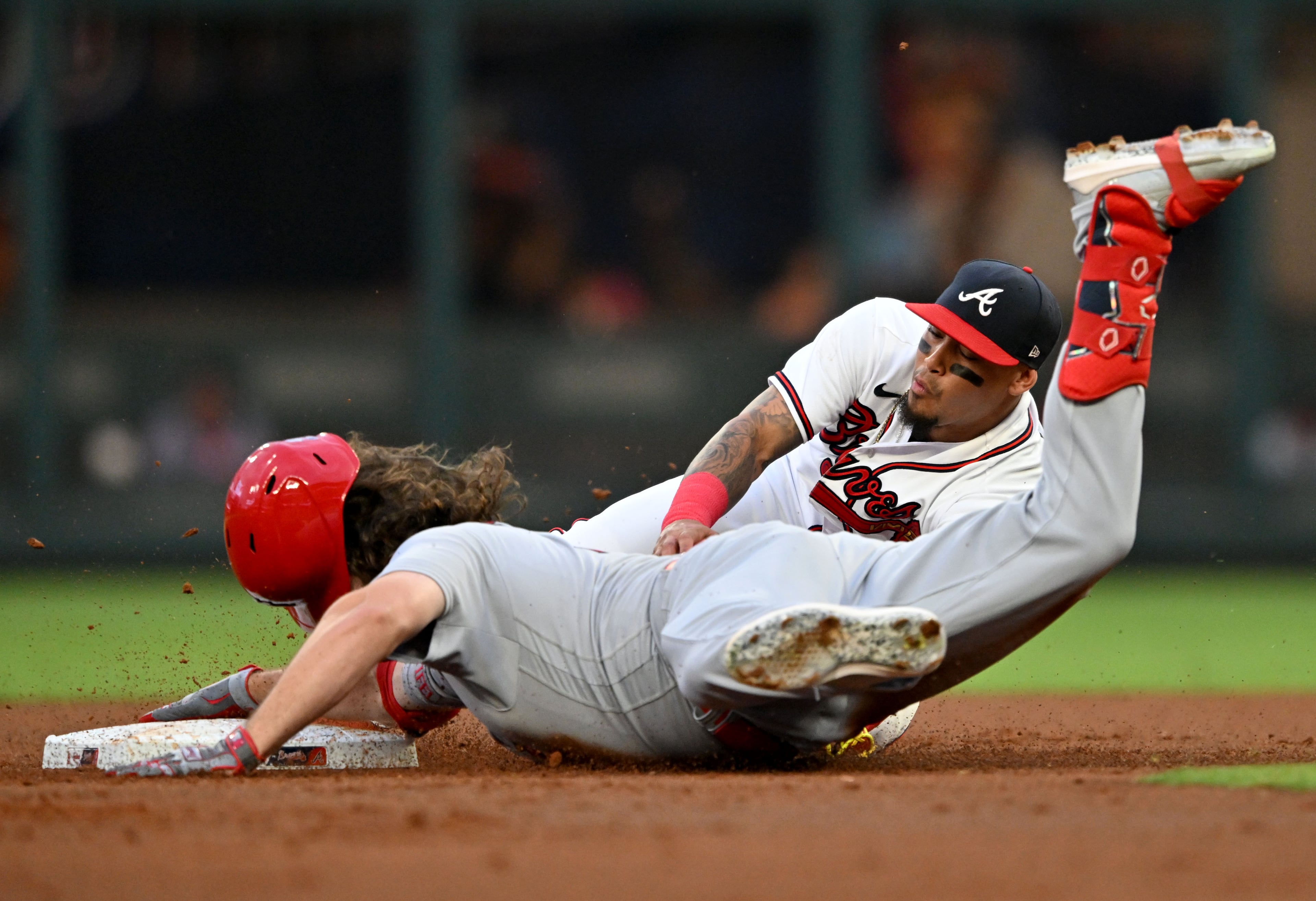 Cardinals' left fielder Alec Burleson (41) is tagged out by Braves' shortstop Orlando Arcia (11) after hitting an RBI during the first inning at Truist Park, Wednesday, September 6, 2023, in Atlanta. (Hyosub Shin / Hyosub.Shin@ajc.com)
