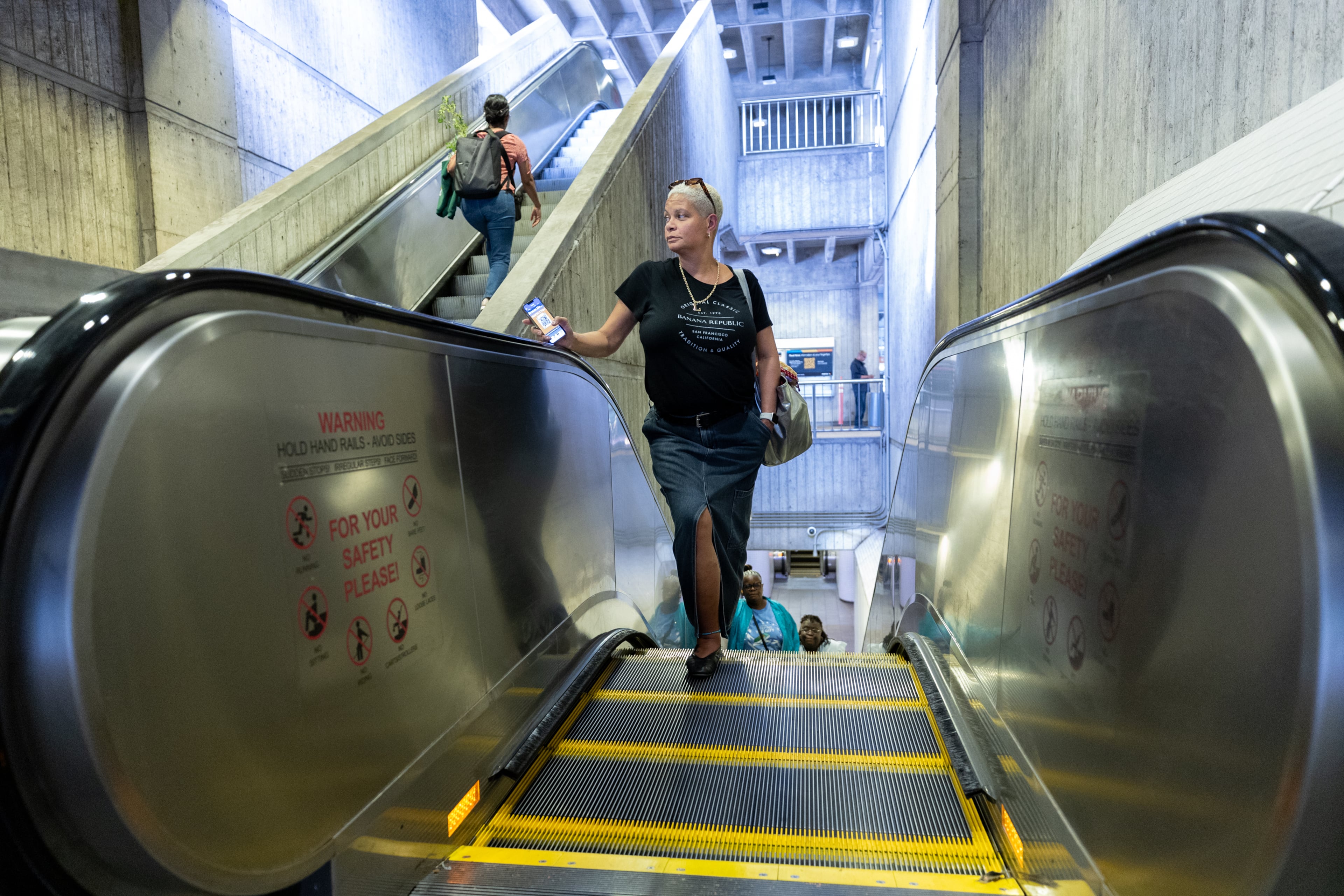 Lurelia Freeman rides an escalator at a MARTA station in Atlanta for her commute from work on Tuesday, Sept. 30, 2025. (Arvin Temkar/AJC)