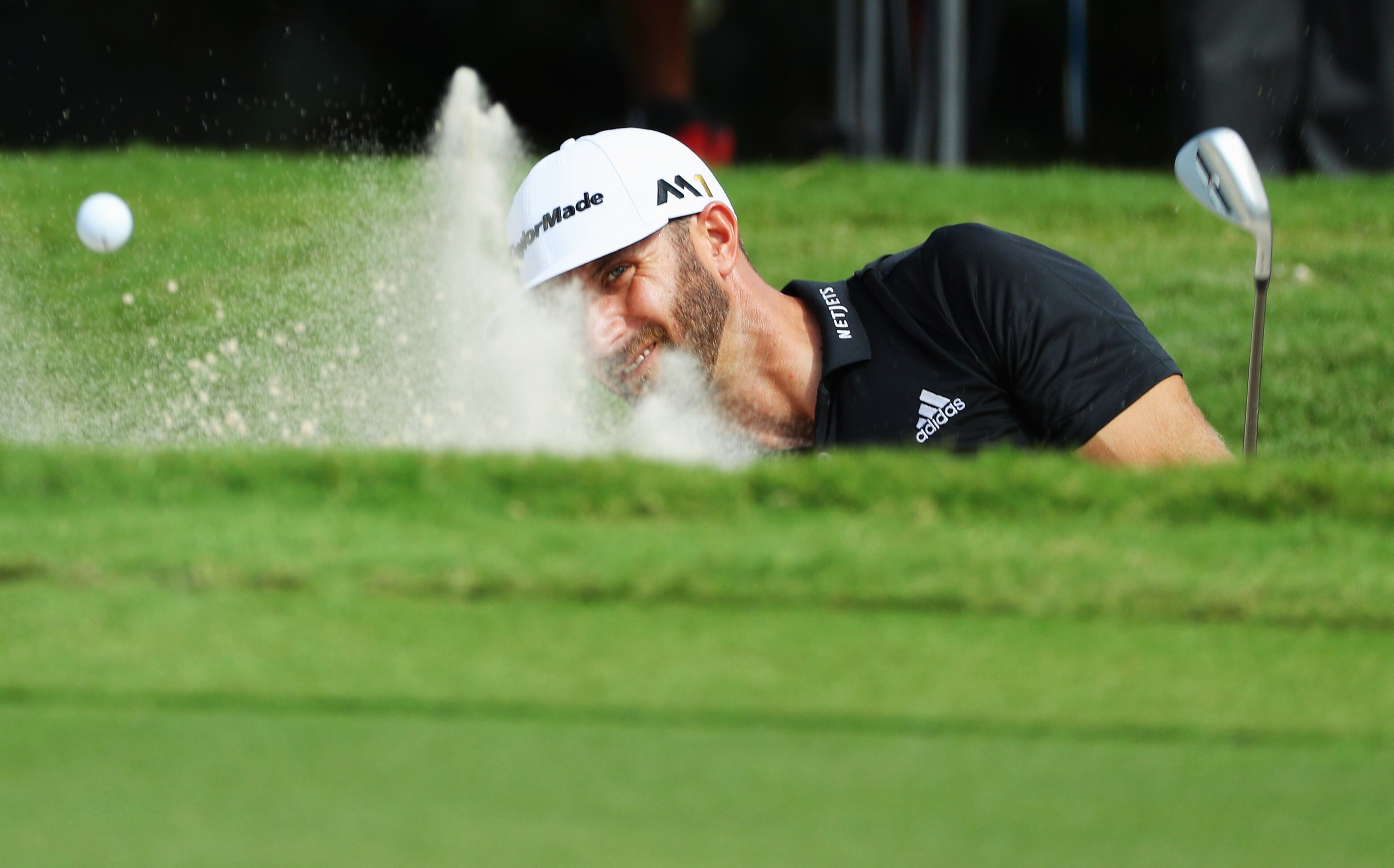 ATLANTA, GA - SEPTEMBER 24: Dustin Johnson plays a bunker shot on the second hole during the third round of the TOUR Championship at East Lake Golf Club on September 24, 2016 in Atlanta, Georgia. (Photo by Scott Halleran/Getty Images)