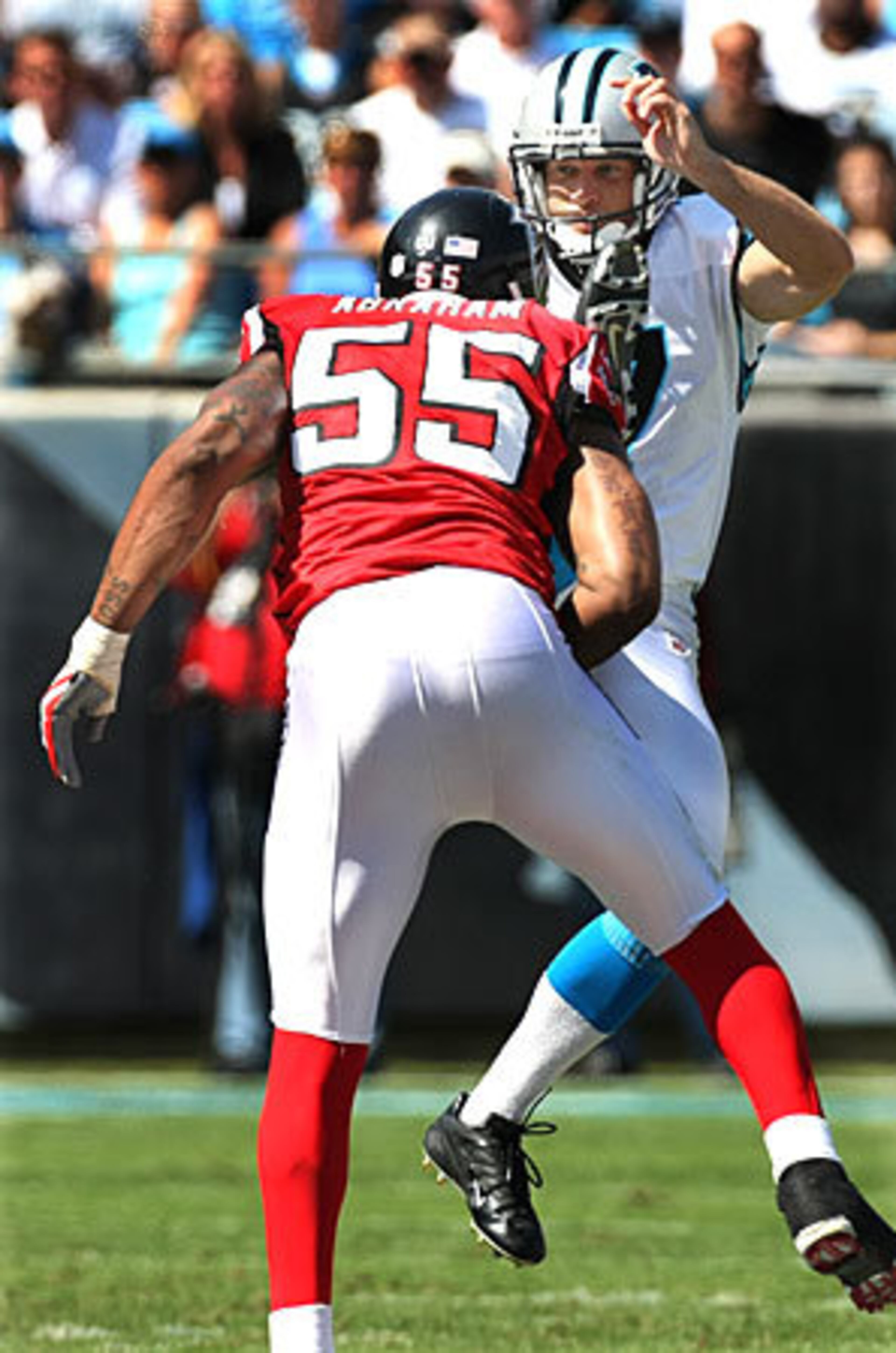 Falcons defensive end John Abraham did not add to his sack total, but did get in Panthers punter Jason Baker's face to block this punt.