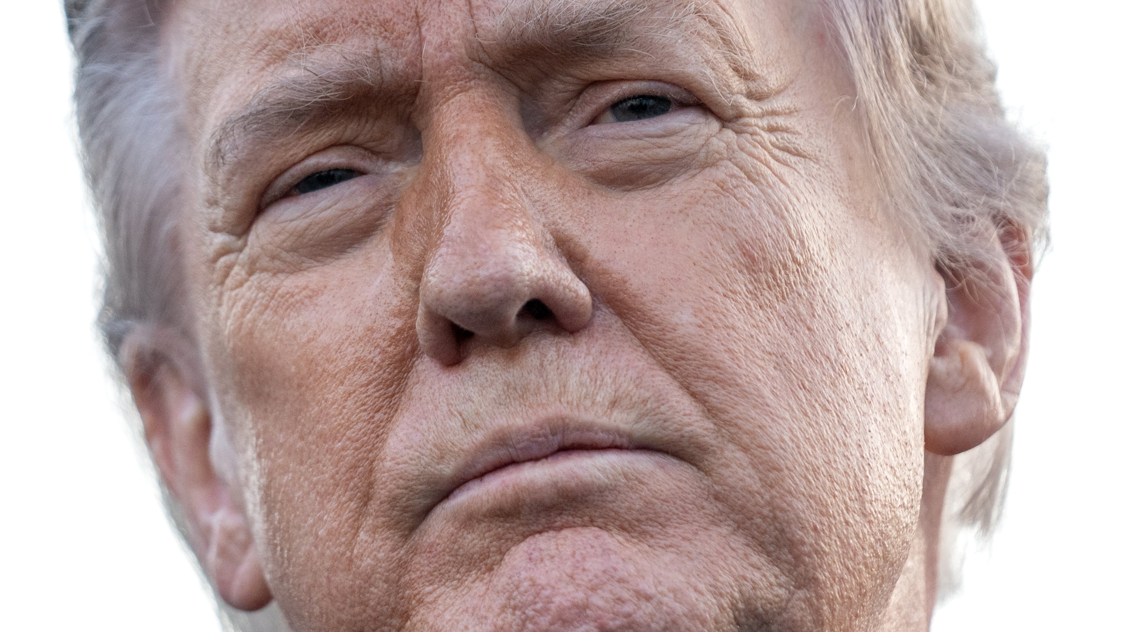 President Donald Trump listens to a reporter's question as he visits the Lincoln Memorial Reflecting Pool to see the new blue protective coating being applied as part of a renovation project, Thursday, May 7, 2026, in Washington. (AP Photo/Mark Schiefelbein)