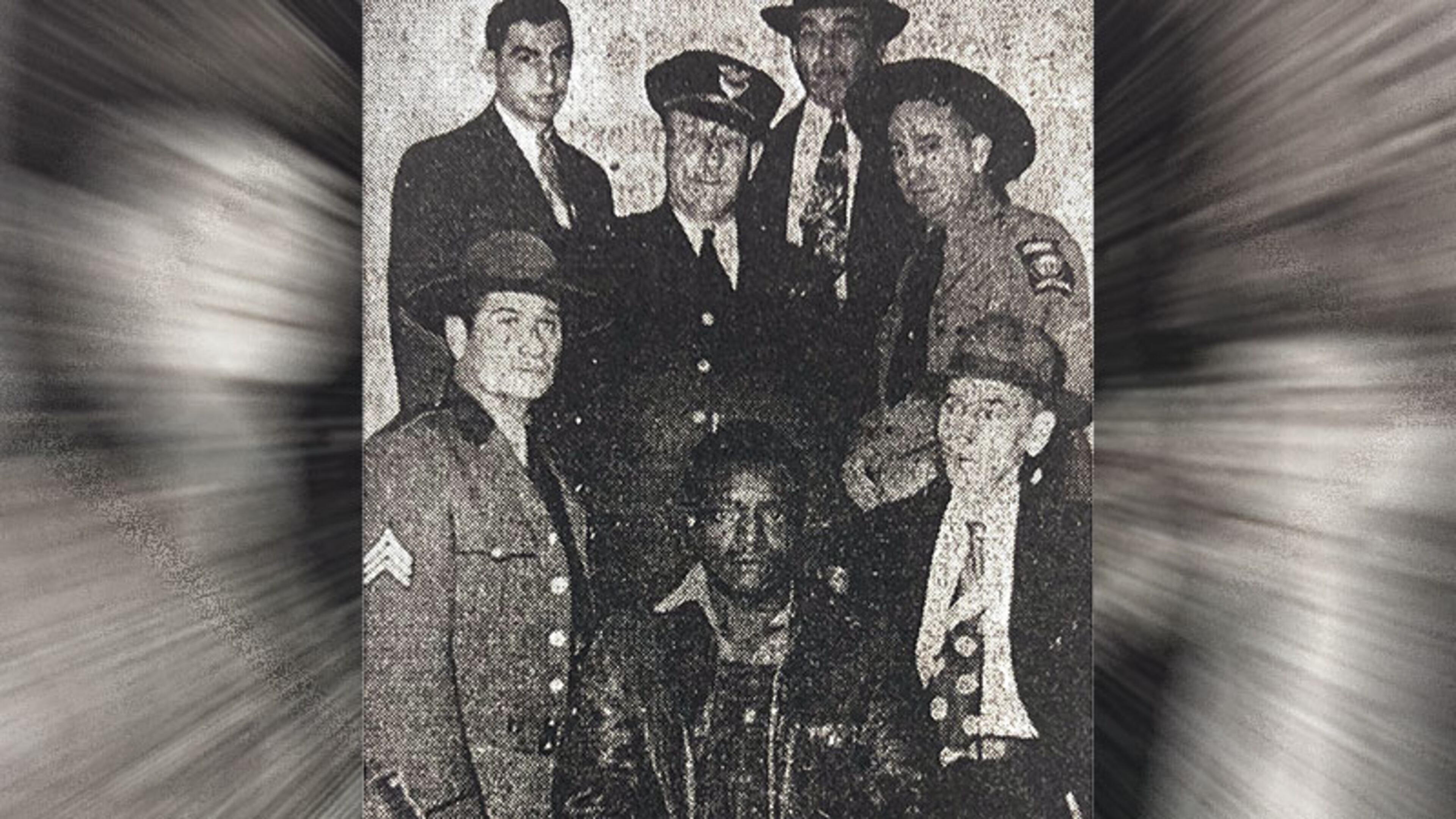 Carrollton sharecropper Clarence Henderson is photographed moments before his one-day trial on Jan. 30, 1950, for the murder of Carl "Buddy" Stevens, Jr. is ringed by state and local law enforcement. The trial was a spectacle and held under tight security with armed state troopers ringing the courtroom.
