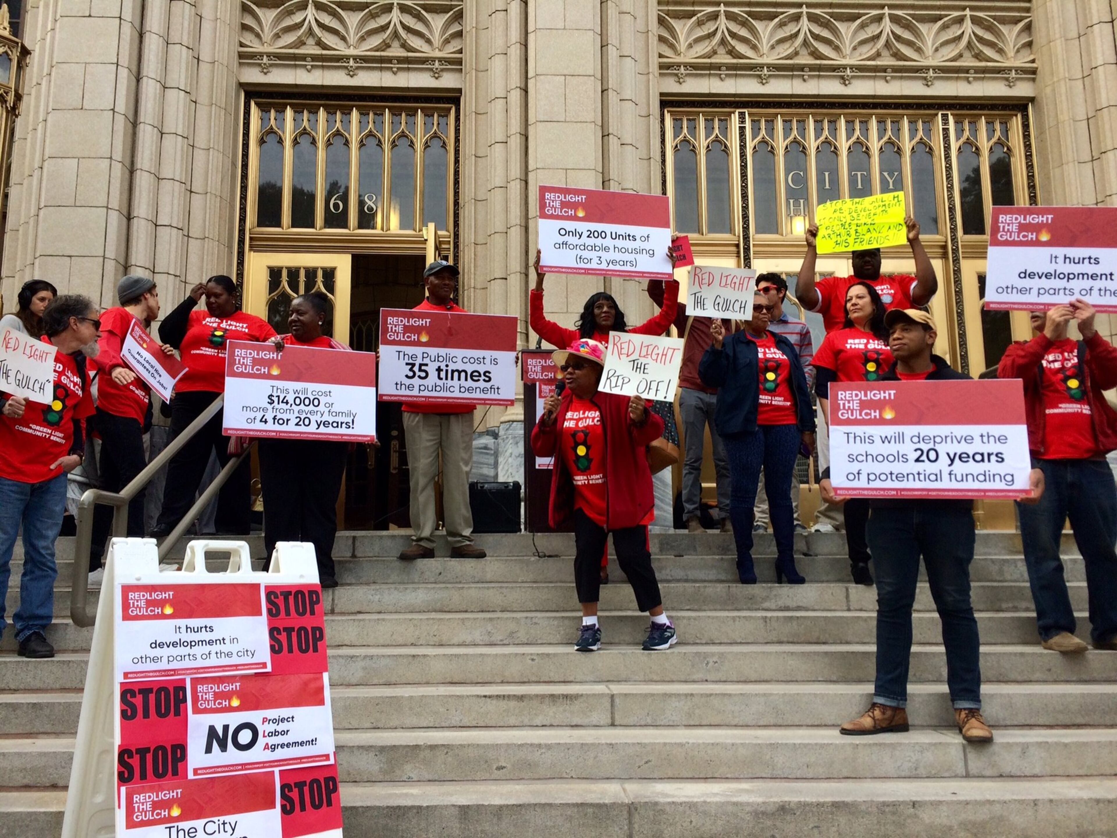 Members of Redlight the Gulch came to City Hall on Tuesday, Oct. 23, 2018, to protest the massive subsidy to develop the 40-acre chasm of train tracks and parking lots in downtown Atlanta.