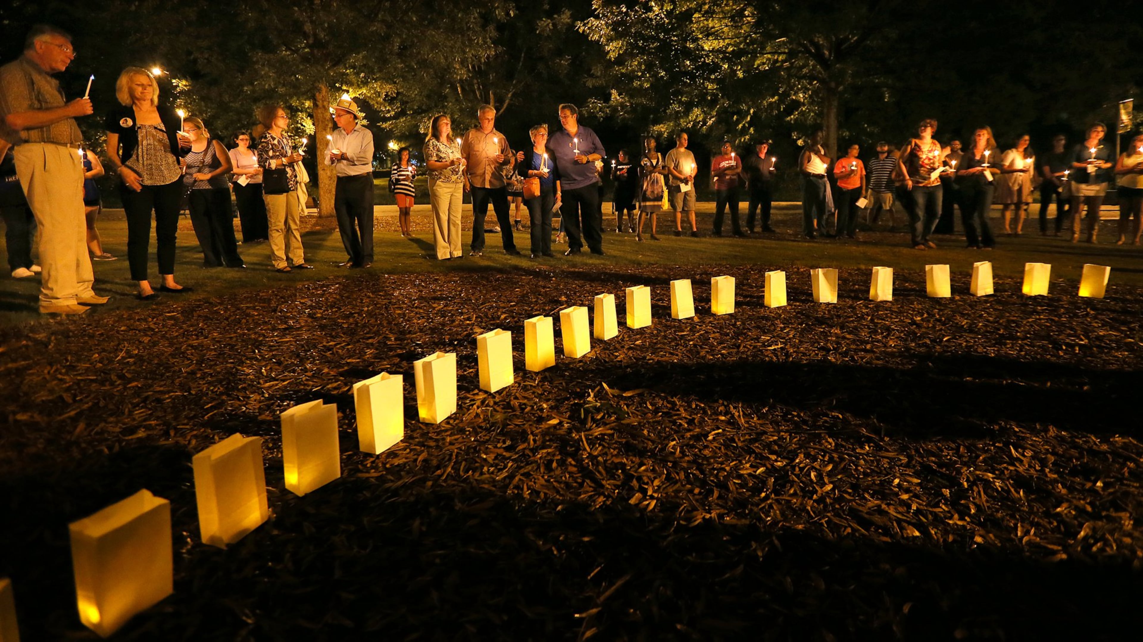 Metro area residents participate in a 2013 candlelight vigil sponsored by the Metro Atlanta Chapter of the American Foundation for Suicide Prevention in Piedmont Park. CURTIS COMPTON/CCOMPTON@AJC.COM