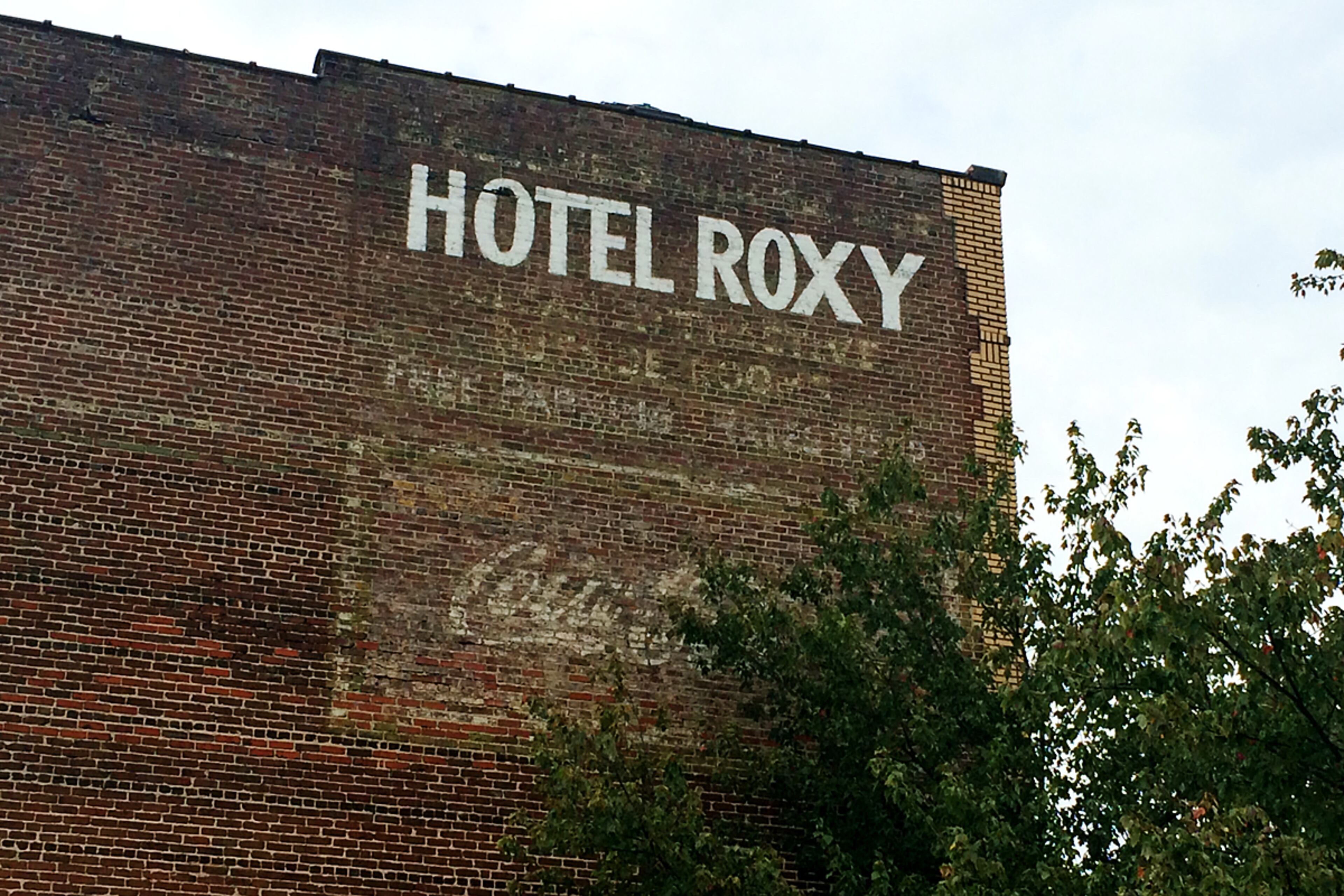 Hotel Roxy on Marietta Street: The name of the hotel (now loft apartments) has been repainted, but the wording underneath is the original. Squint, and you can still make out the words "attractive" and "free parking." A Coca-Cola advertisement also sits below the hotel's information. (PETE CORSON / PCORSON@AJC.COM)
