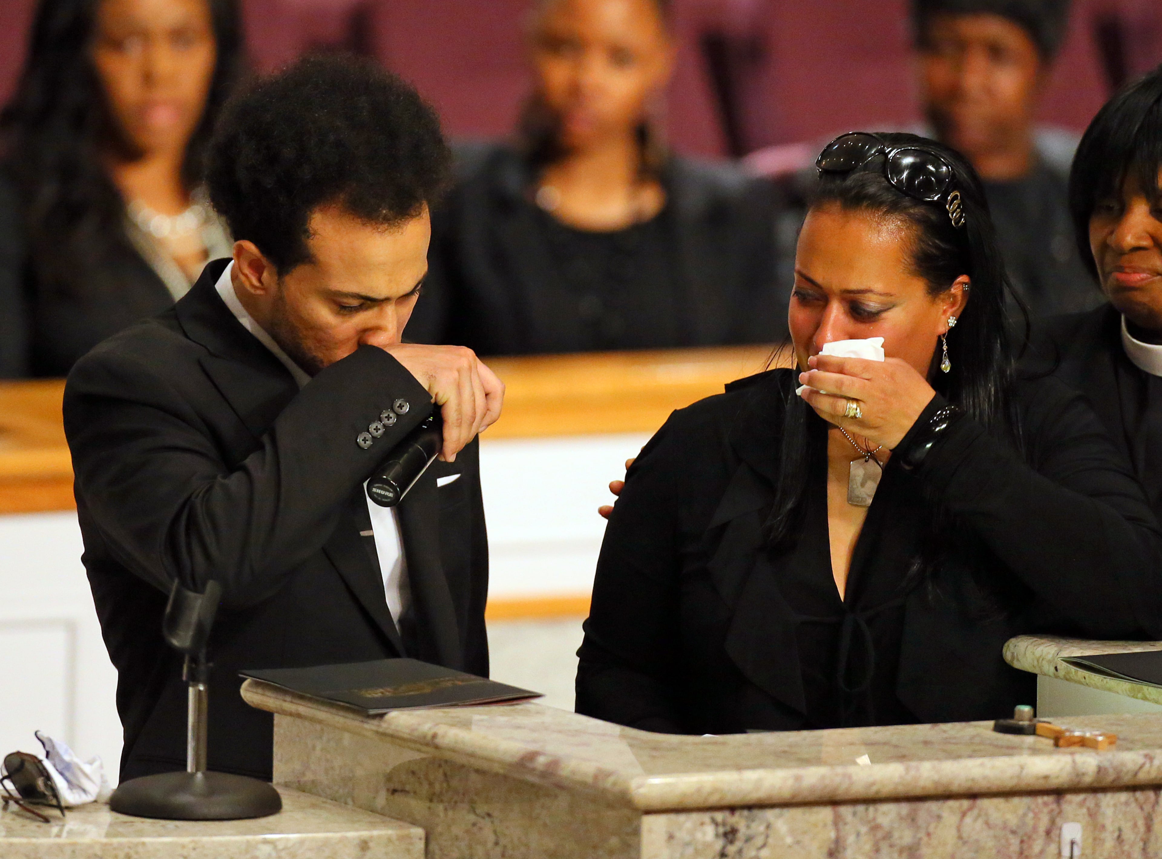 Former Kris Kross member Chris Smith and his sister Jennifer Smith begin to weep while speaking at the funeral of Chris Kelly.
