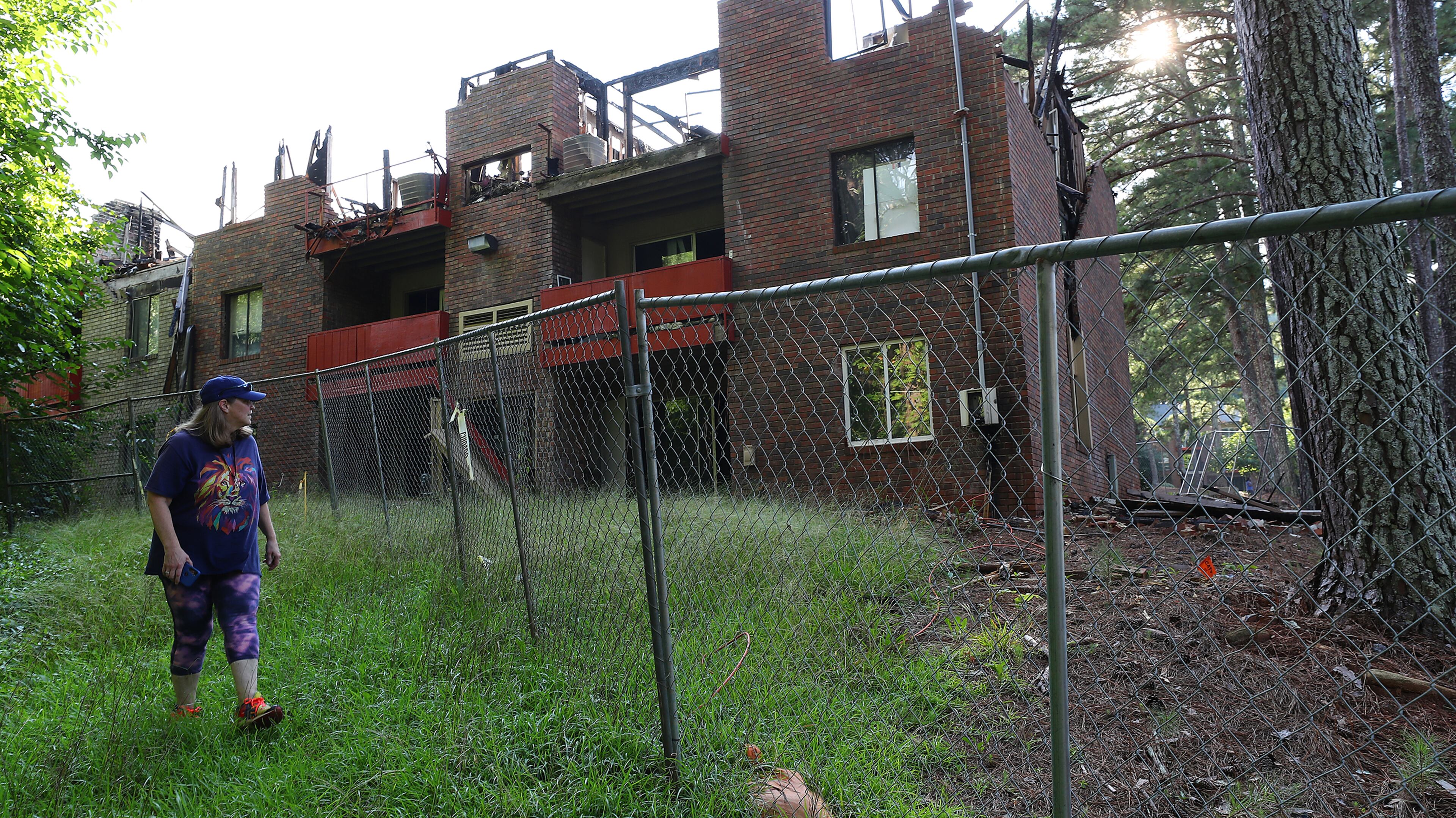 The ruins of a burnt out building at what was then called The Village at Kensington remained standing September 2022, six months after a blaze brought down its roof. The Dekalb County complex has since been renamed Avondale Village and was highlighted in The Atlanta Journal-Constitution's "Dangerous Dwellings" series. The complex is included in the newspaper's online database of apartments with rampant crime, code violations, fires and other hazards that put residents at risk. (Curtis Compton / Curtis.Compton@ajc.com)