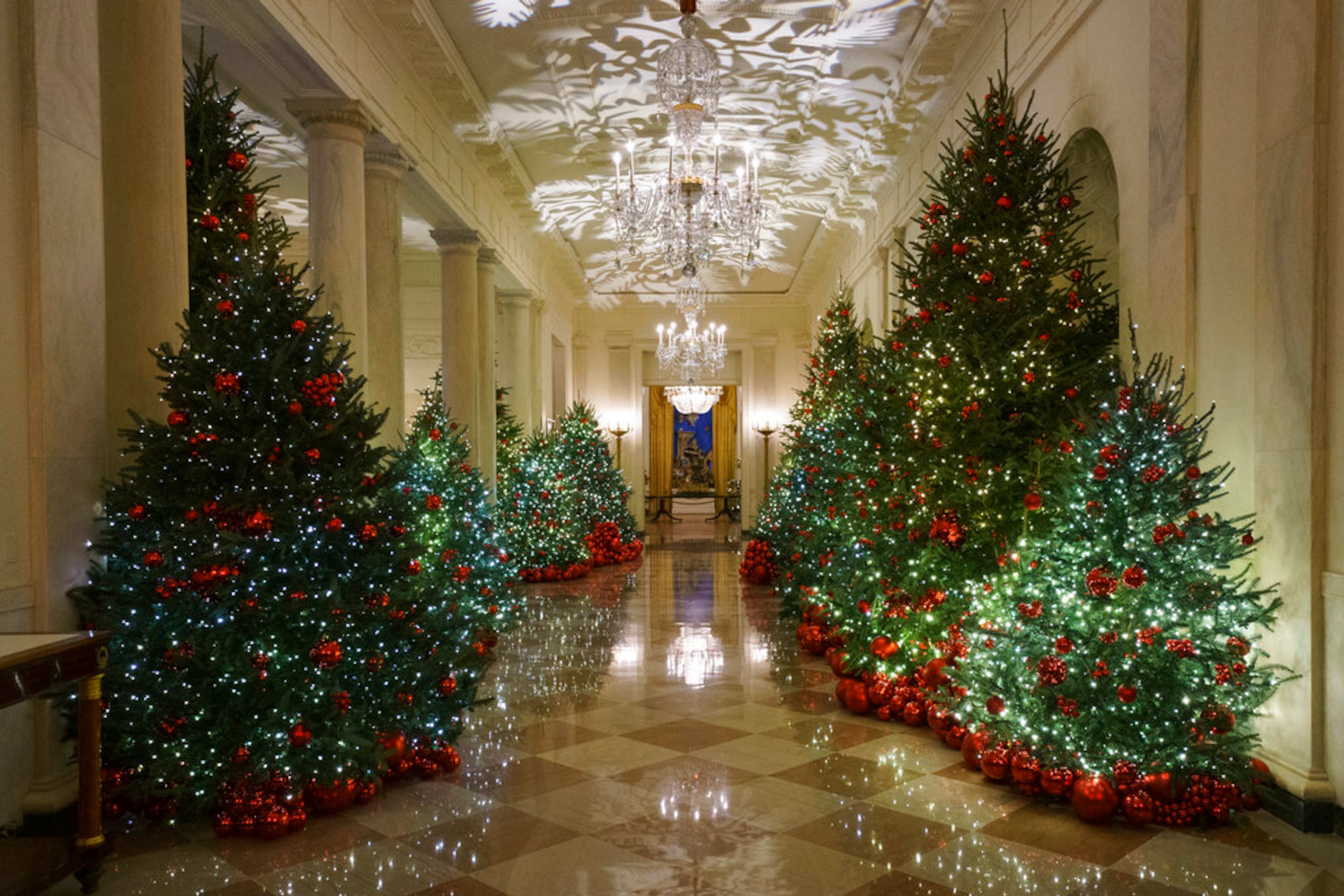The Cross Hall is seen during the 2018 Christmas Press Preview at the White House in Washington, Monday, Nov. 26, 2018. Christmas has arrived at the White House. First lady Melania Trump unveiled the 2018 White House holiday decor on Monday. She designed the decor, which features a theme of "American Treasures." (AP Photo/Carolyn Kaster)