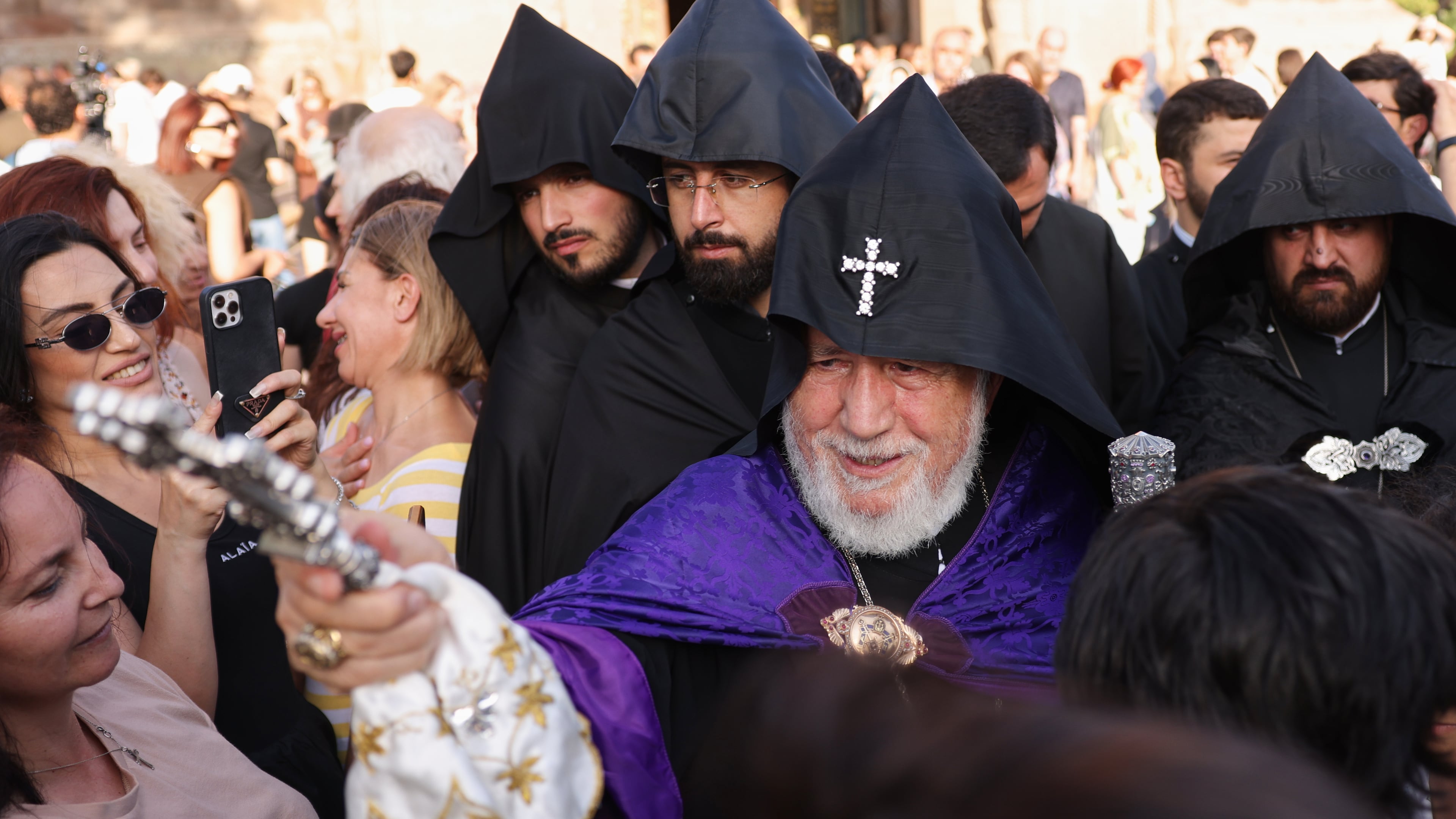 The head of the Armenian Apostolic Church Catholicos Karekin II, center, blesses people in Vagharshapat, Armenia, Friday, Aug. 7, 2026. (AP Photo/Anthony Pizzoferrato)
