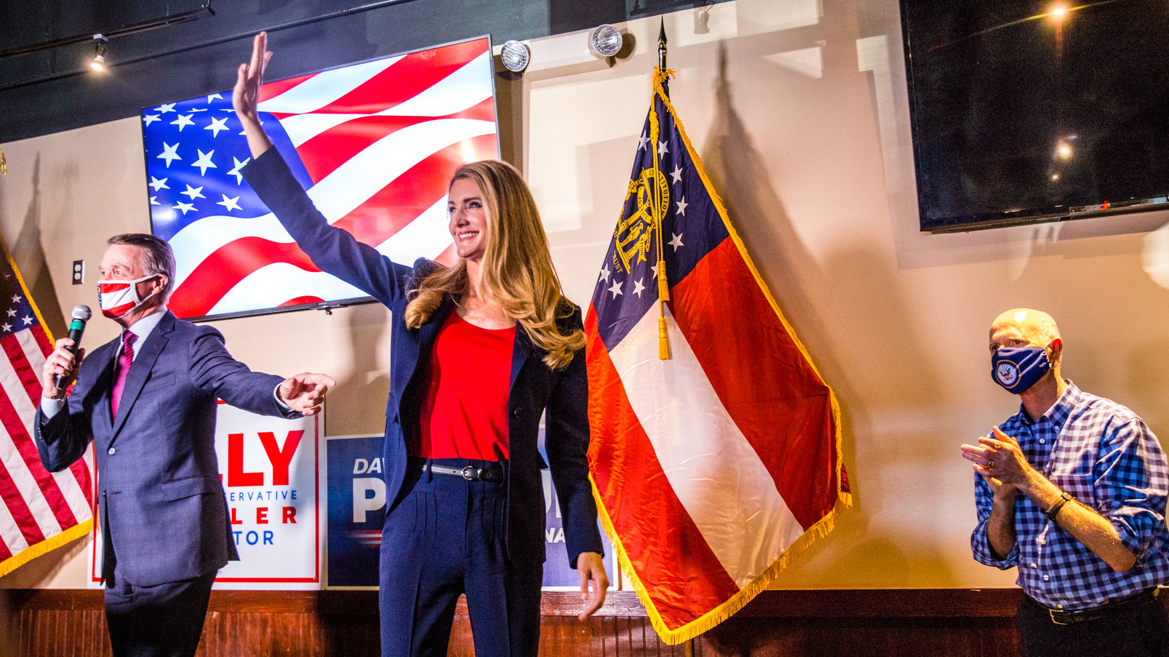 Senators David Perdue, left, Kelly Loeffler, center, and Florida Senator Rick Scott, right, joined together for a rally on Friday, November 13, 2020 at Black Diamond Grill in Cumming, GA. Both Georgia candidates head to a run-off election in January. (Jenni Girtman for The Atlanta Journal Constitution)