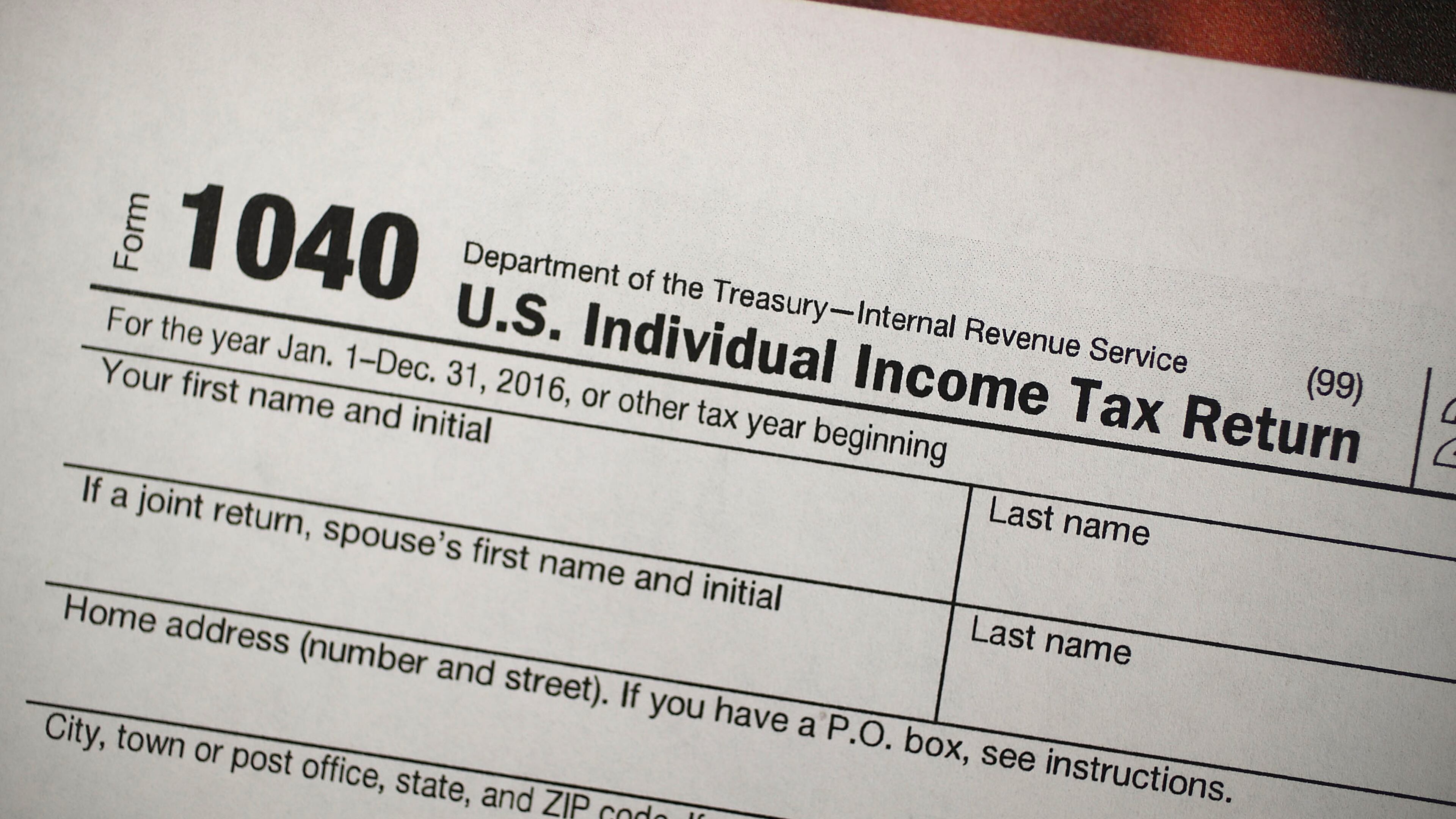 A copy of a IRS 1040 tax form is seen at an H&R Block office on the day President Donald Trump signed the Republican tax cut bill in Washington, D.C., on Dec. 22, 2017 in Miami, Fla. (Photo by Joe Raedle/Getty Images)