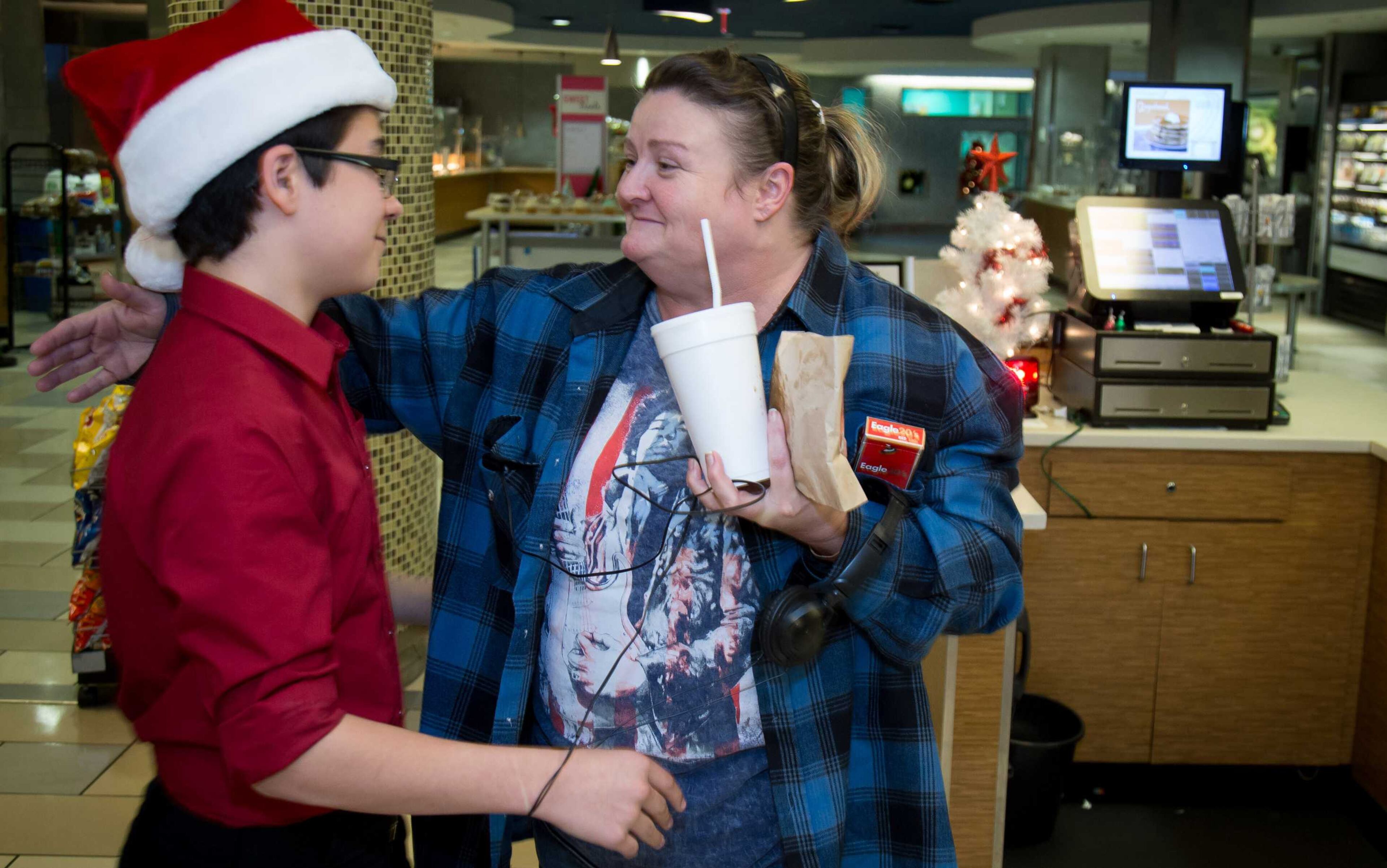 Kim Cheek, right, gives Jerry Hatcher, Jr., a big hug after Jerry bought her breakfast Sunday at Children's Healthcare of Atlanta at Scottish Rite Hospital on Sunday, Dec. 24, 2017.