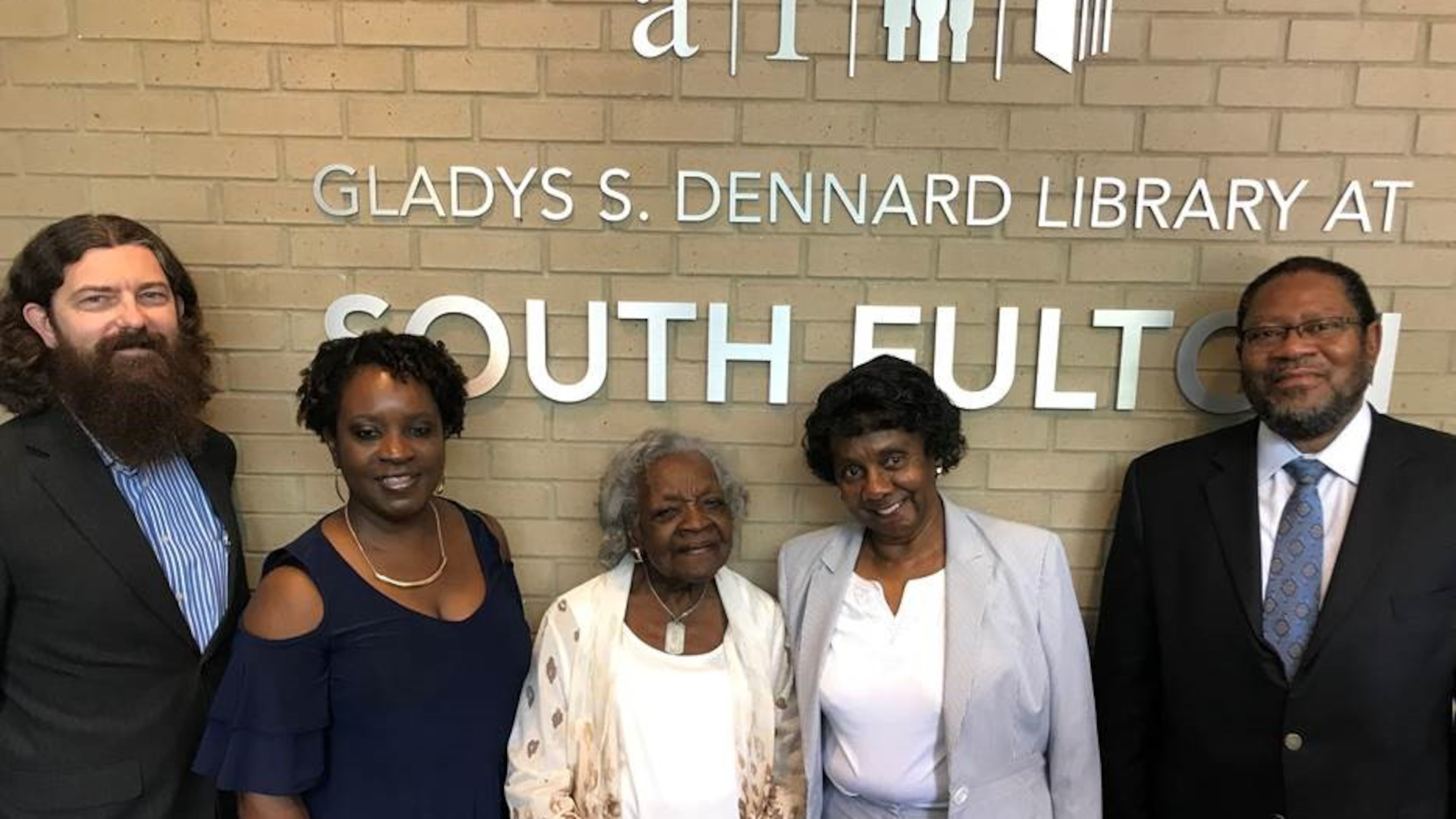 Library officials and relatives of Gladys Dennard remembered her at a renaming ceremony. FULTON COUNTY
