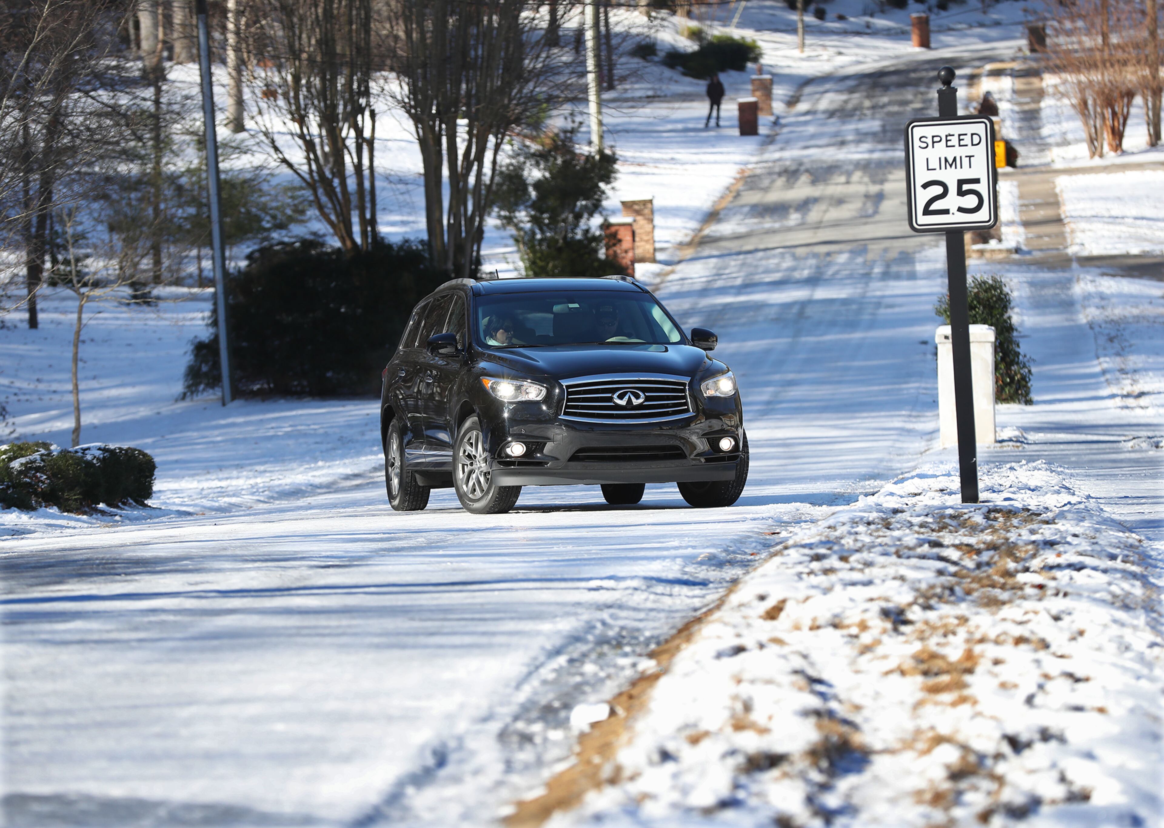 January 8, 2017, Canton: A motorist slips back down Pine Terrace Road unable to make it up the ice covered road in Cherokee Falls Estates at the Lake on Sunday, Jan. 8, 2017, in Canton. Secondary roads are still a safety concern for motorists. Curtis Compton/ccompton@ajc.com