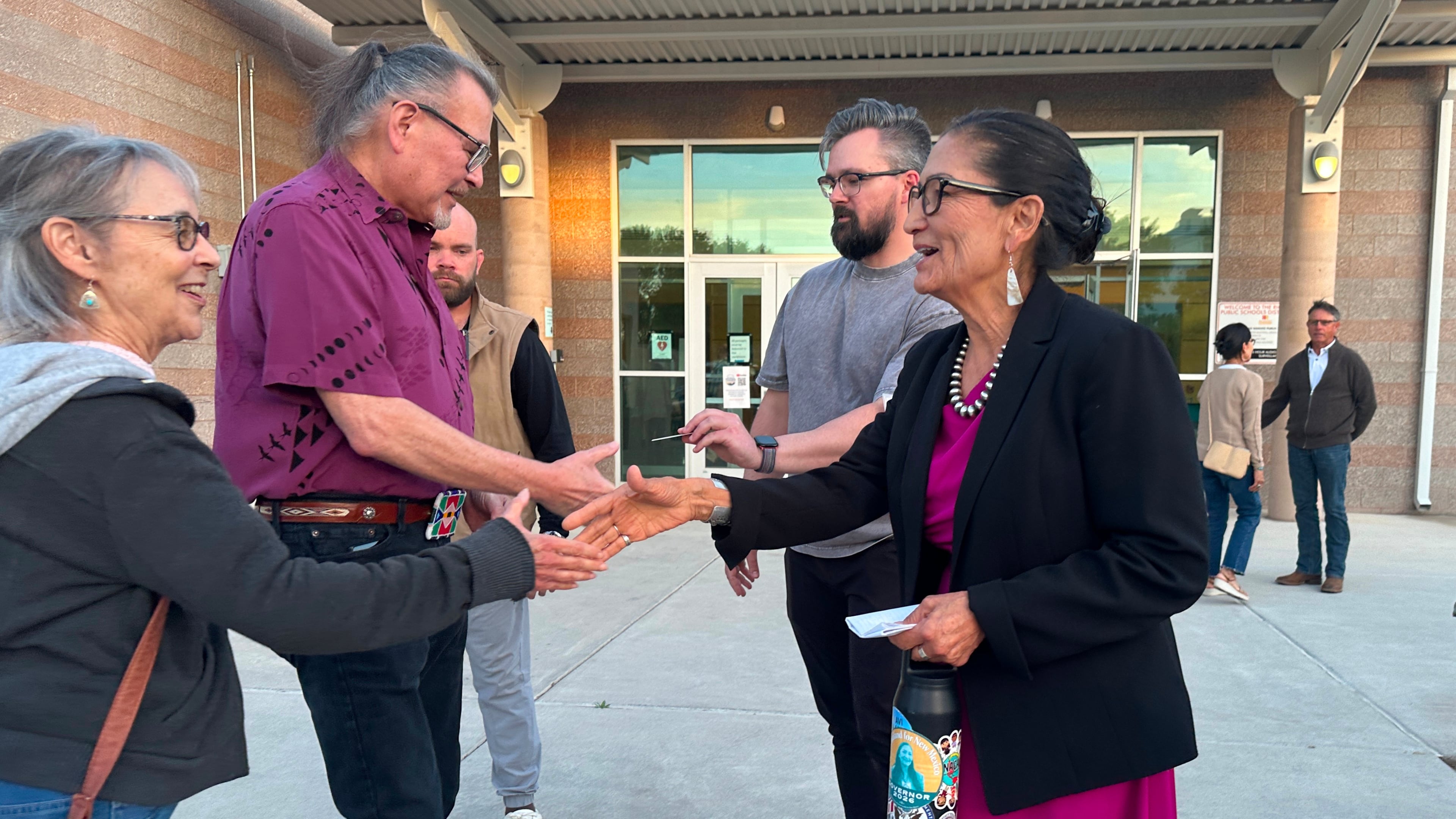Former U.S. Interior Secretary Deb Haaland, a Democratic candidate for governor of New Mexico, greets people outside a candidate forum in Rio Rancho, N.M., on April 28, 2026, ahead of a June 2 primary election. (AP Photo/Morgan Lee)