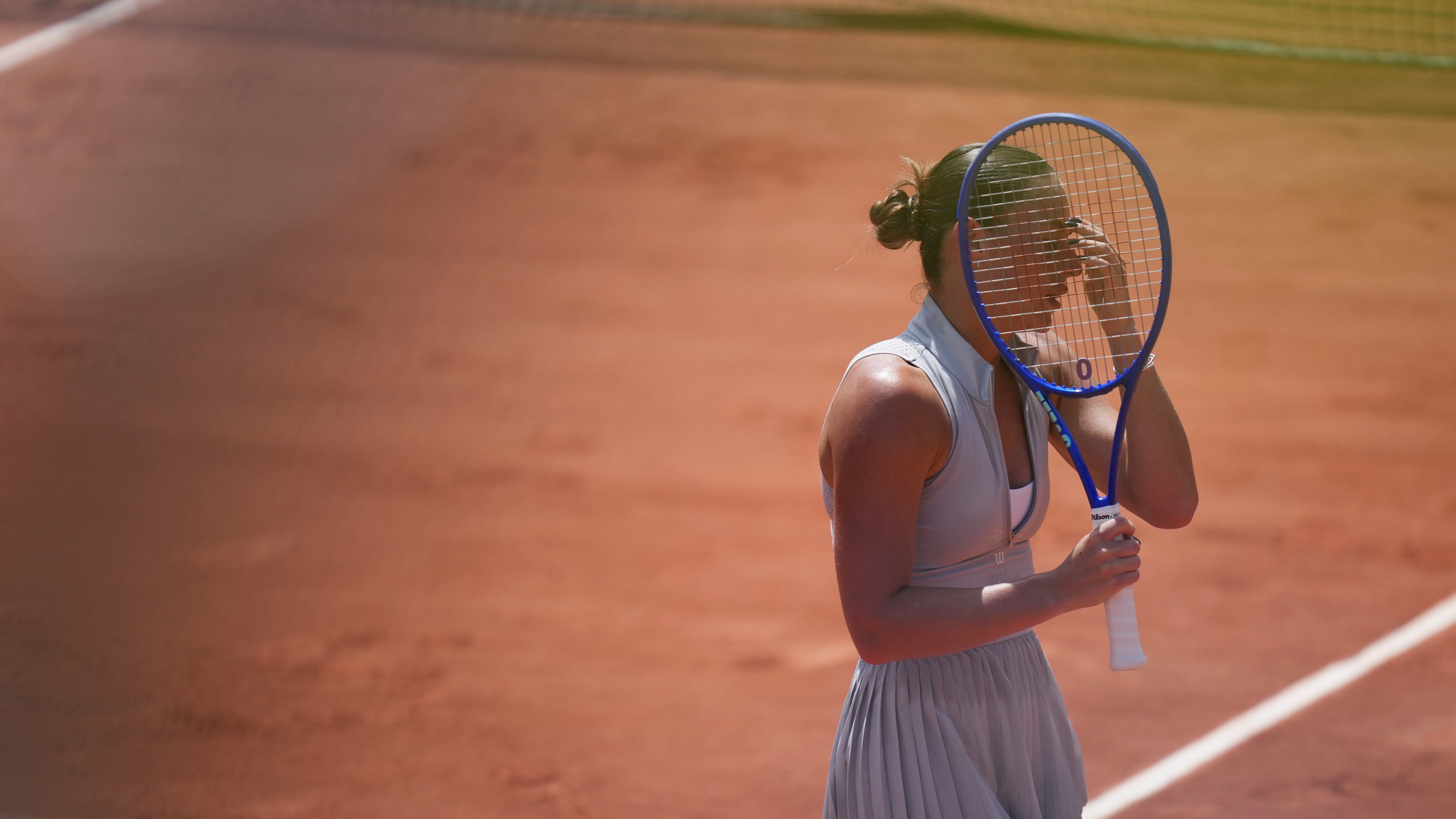 Marta Kostyuk of Ukraine celebrates as she won against Oksana Selekhmeteva of Spain during their first round women's singles tennis match at the French Open tennis tournament in Paris, Sunday, May 24, 2026. (AP Photo/Thibault Camus)