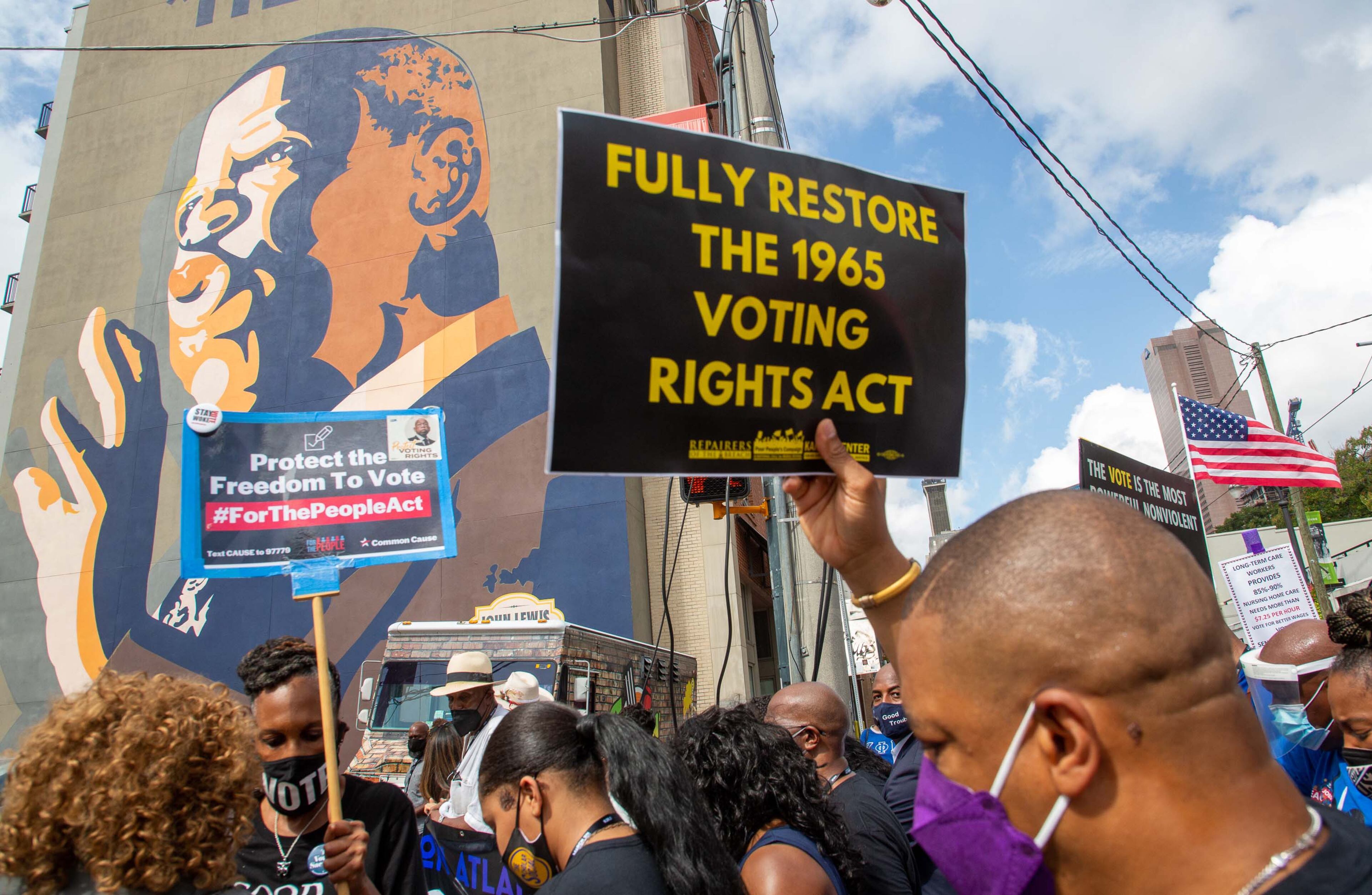 The March On For Voting Rights reaches the John Lewis mural on Auburn Avenue in Atlanta on Saturday, August 28, 2021. STEVE SCHAEFER FOR THE ATLANTA JOURNAL-CONSTITUTION