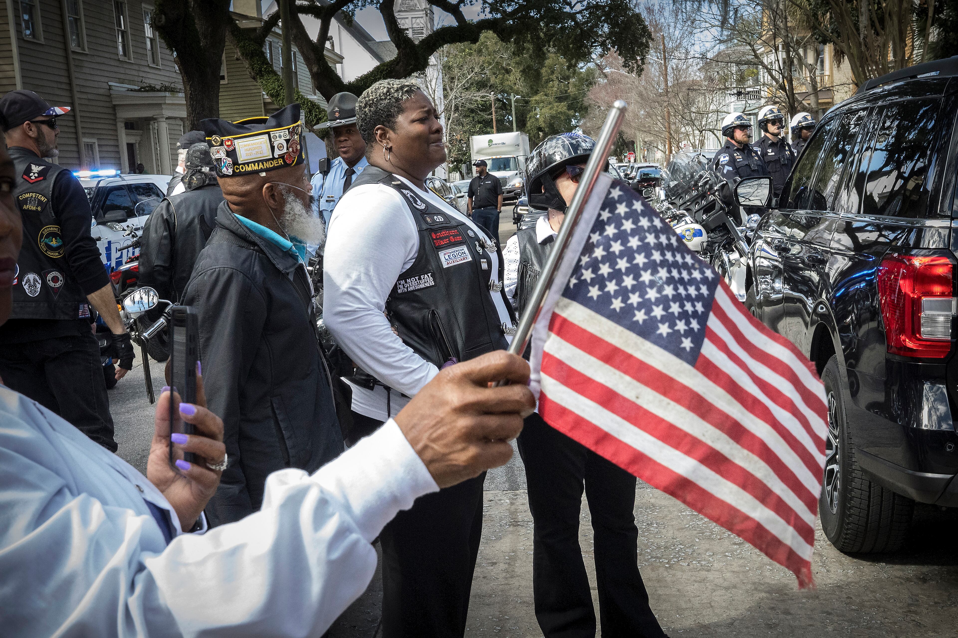 Dana Fisher, center, and members of the American Legion Riders Post 184 stand outside Campbell and Sons Funeral Home after the remains of U.S. Army Reservist Sgt. Breonna Moffett were brought inside, Thursday, Feb. 15, 2024, Savannah, Ga. Moffett was killed in a drone attack in January along with two other U.S. servicemen in Jordan. (AJC Photo/Stephen B. Morton)