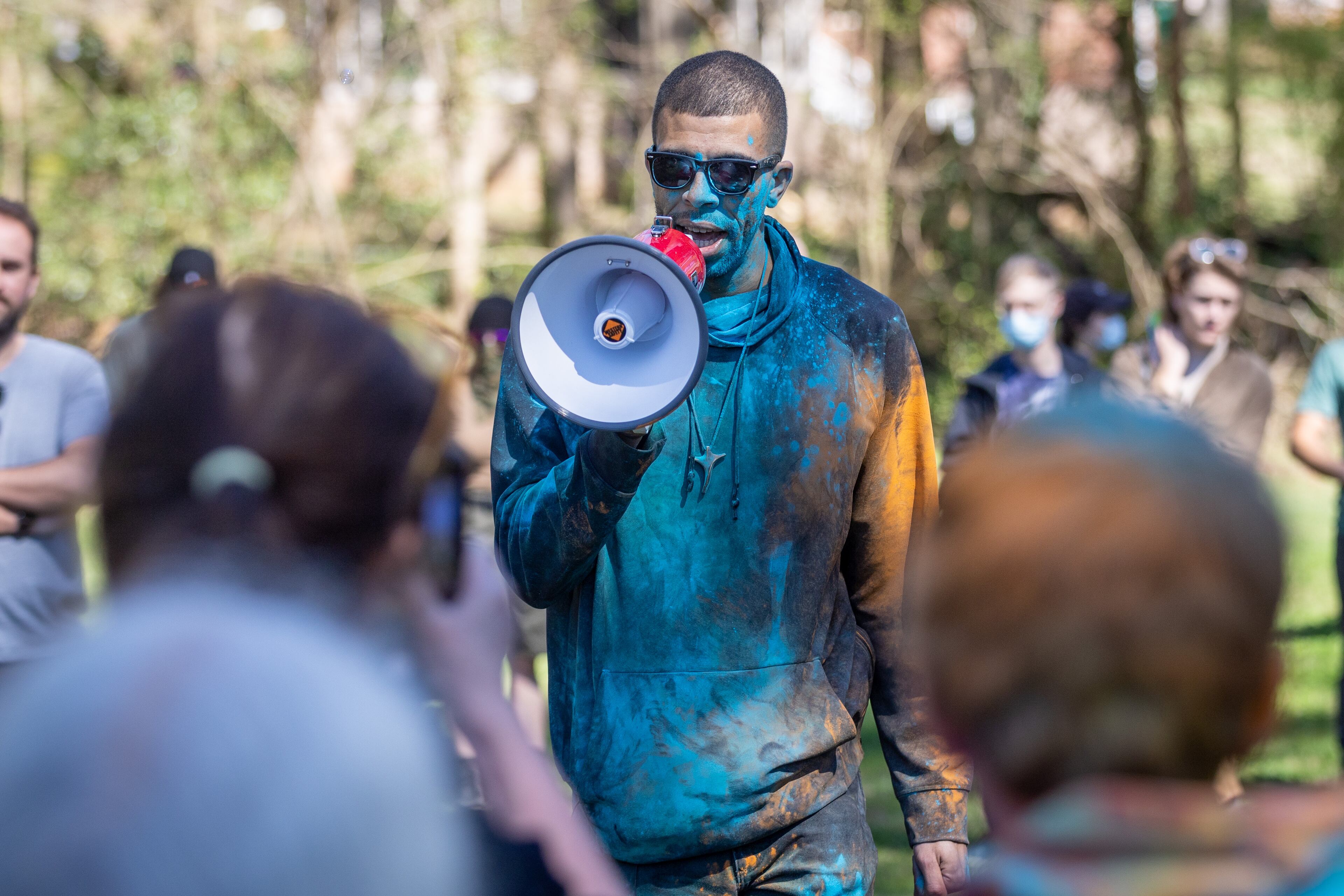 Matthew Johnson (left) talks to the crowd during the Defend the Atlanta Forest and public safety training center protest at Gresham Park in Atlanta on Saturday, March 4, 2023. (Steve Schaefer/steve.schaefer@ajc.com)