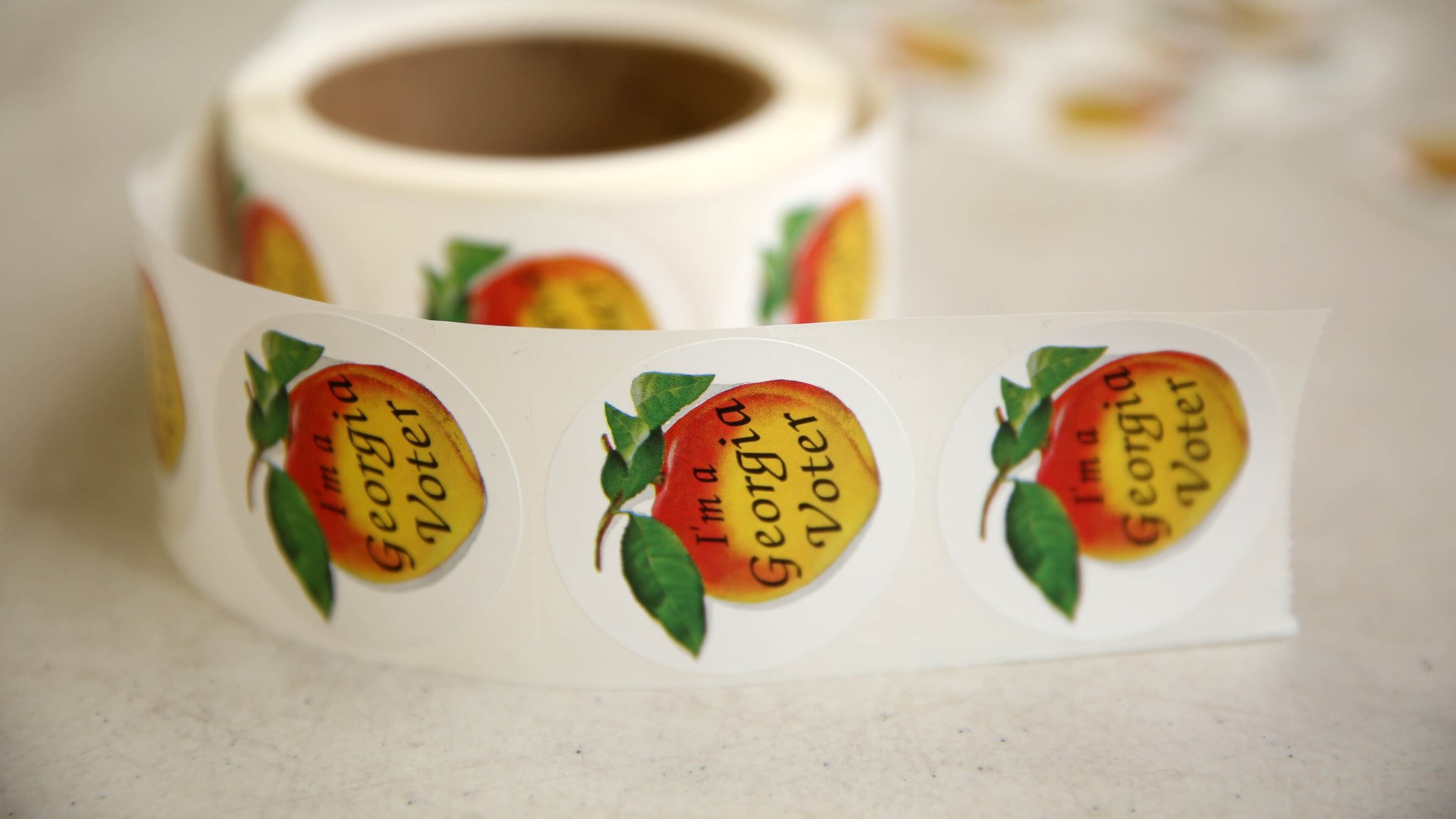 “I’m A Georgia Voter” stickers are shown during the Georgia runoff election voting at Henry W. Grady High School Tuesday, July 24, 2018, in Atlanta. (JASON GETZ/SPECIAL TO THE AJC)