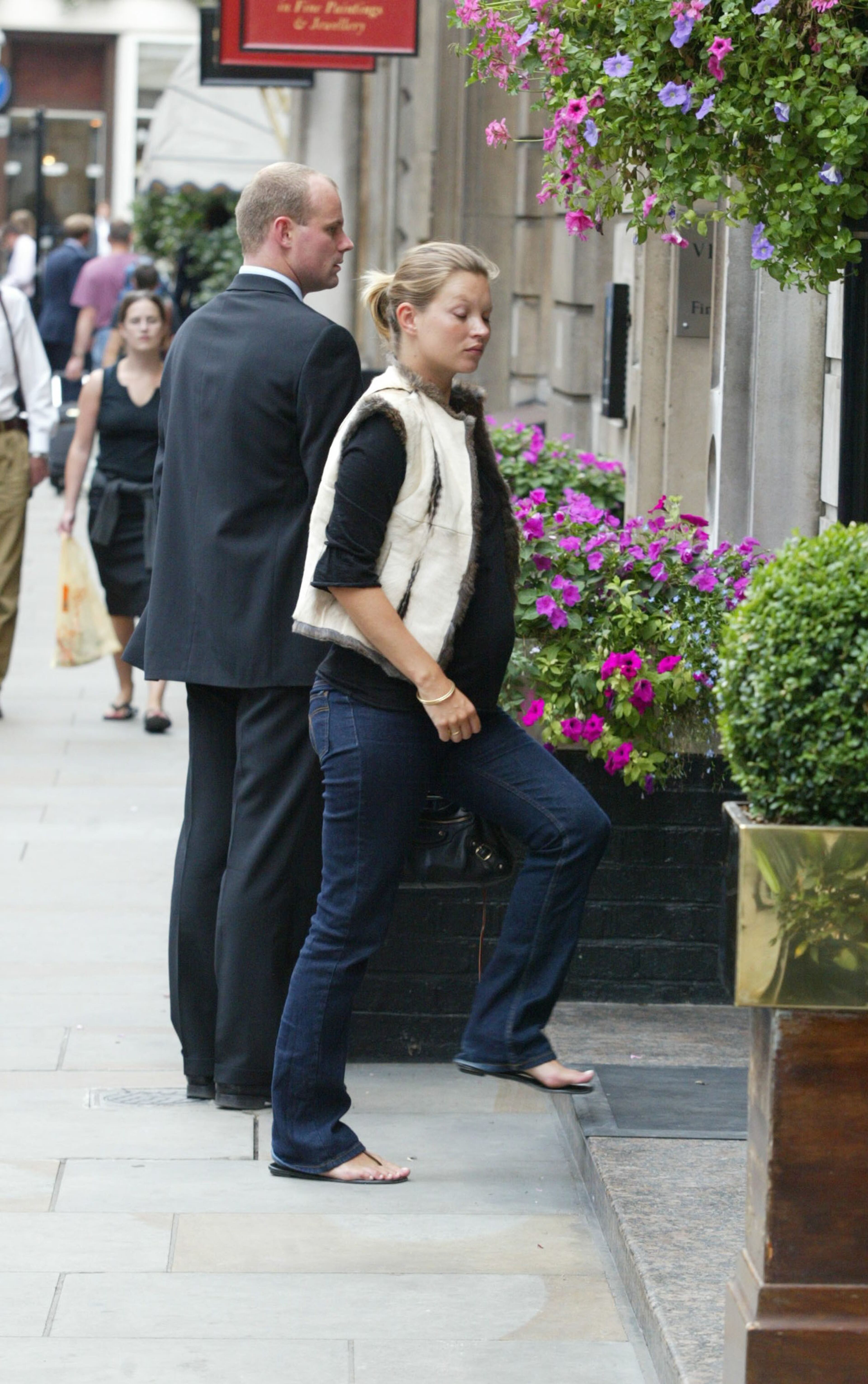 Model Kate Moss walks to Wiltons Restaurant August 22, 2002 in London England.