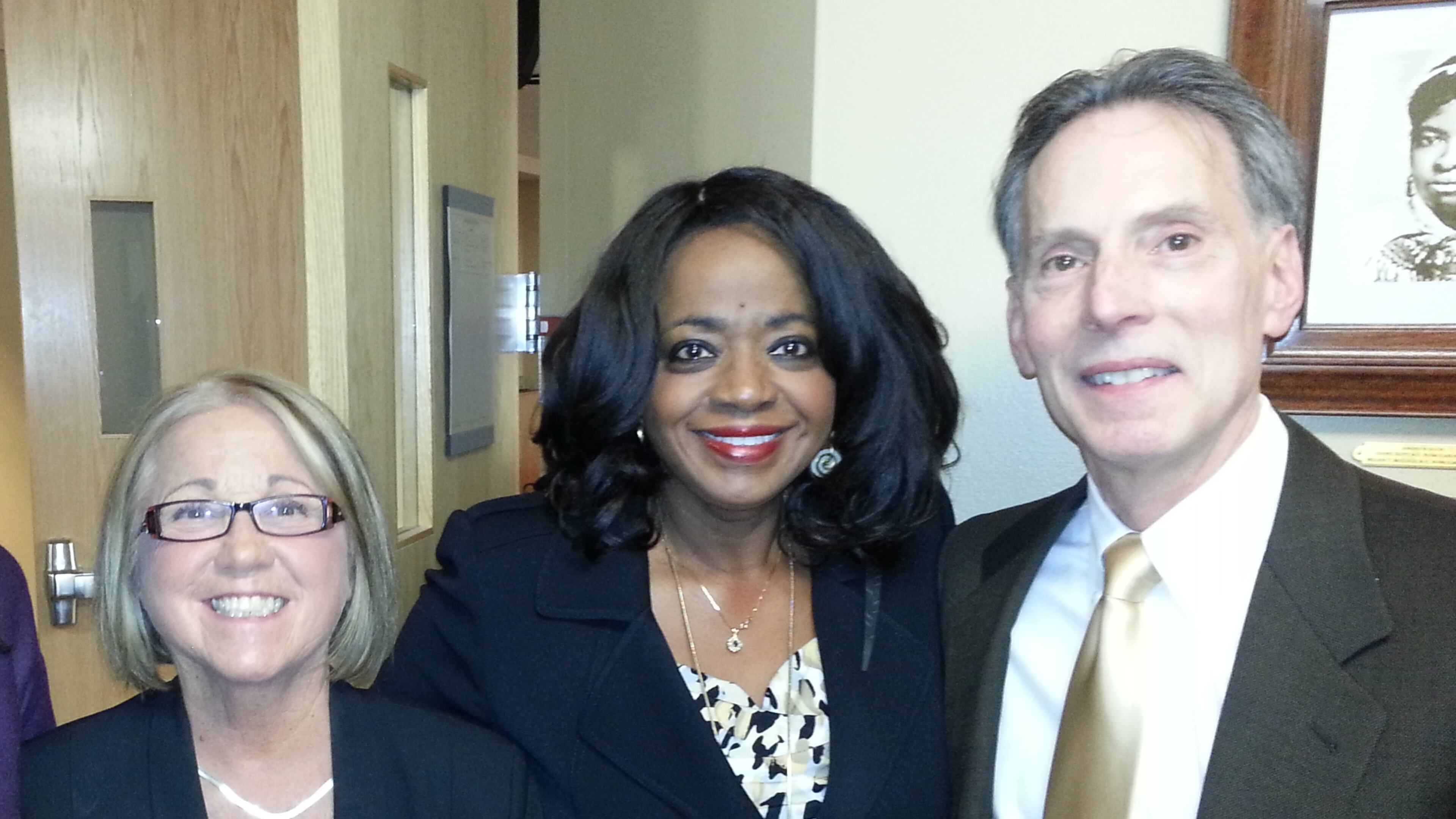 Atlanta's Dr. Melody McCloud (center) is joined by Boston University School of Medicine's Dr. Jean Ramsey assistant dean of alumni affairs, and Dr. Doug Hughes associate dean of academic affairs, at the Dr. Rebecca Lee Crumpler exhibit unveiling on Feb. 19, 2016.