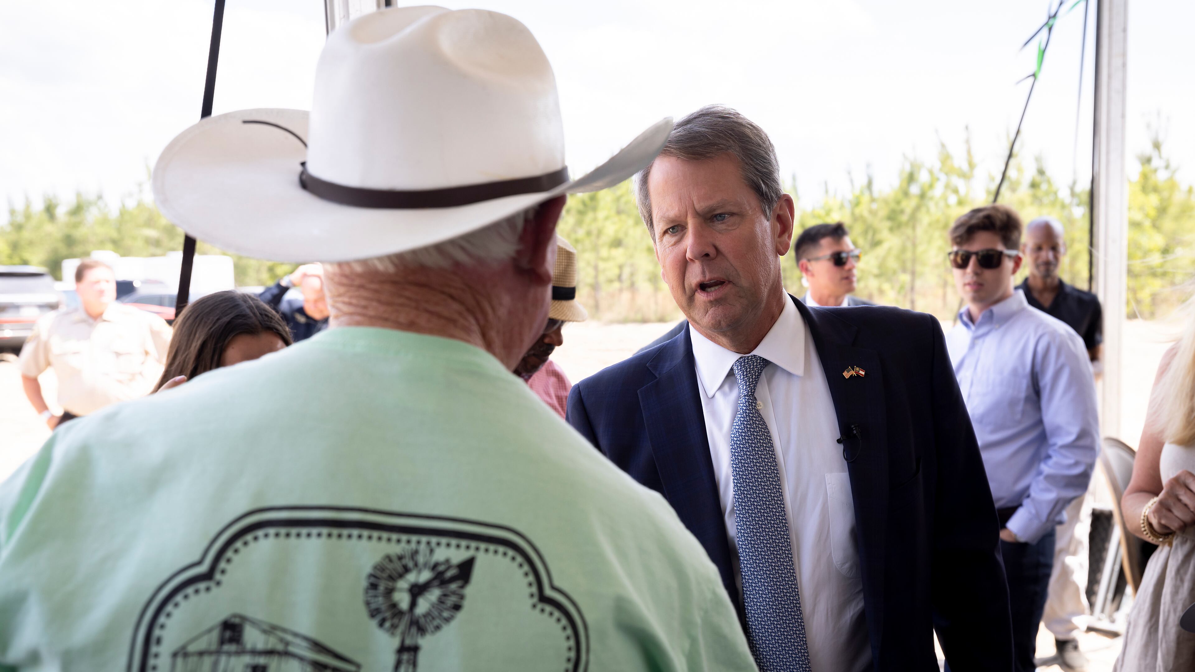 Gov. Brian Kemp begins a southeast Georgia swing Monday that features a stop in the Savannah area to celebrate the groundbreaking of Hyundai Motogroup’s $5.5 billion “Metaplant America,” the largest economic development project in state history. He is pictured greeting people before announcing in May that the South Korean automotive giant would be building an electric vehicle plant in Ellabell, Ga. (Stephen B. Morton/AJC)
