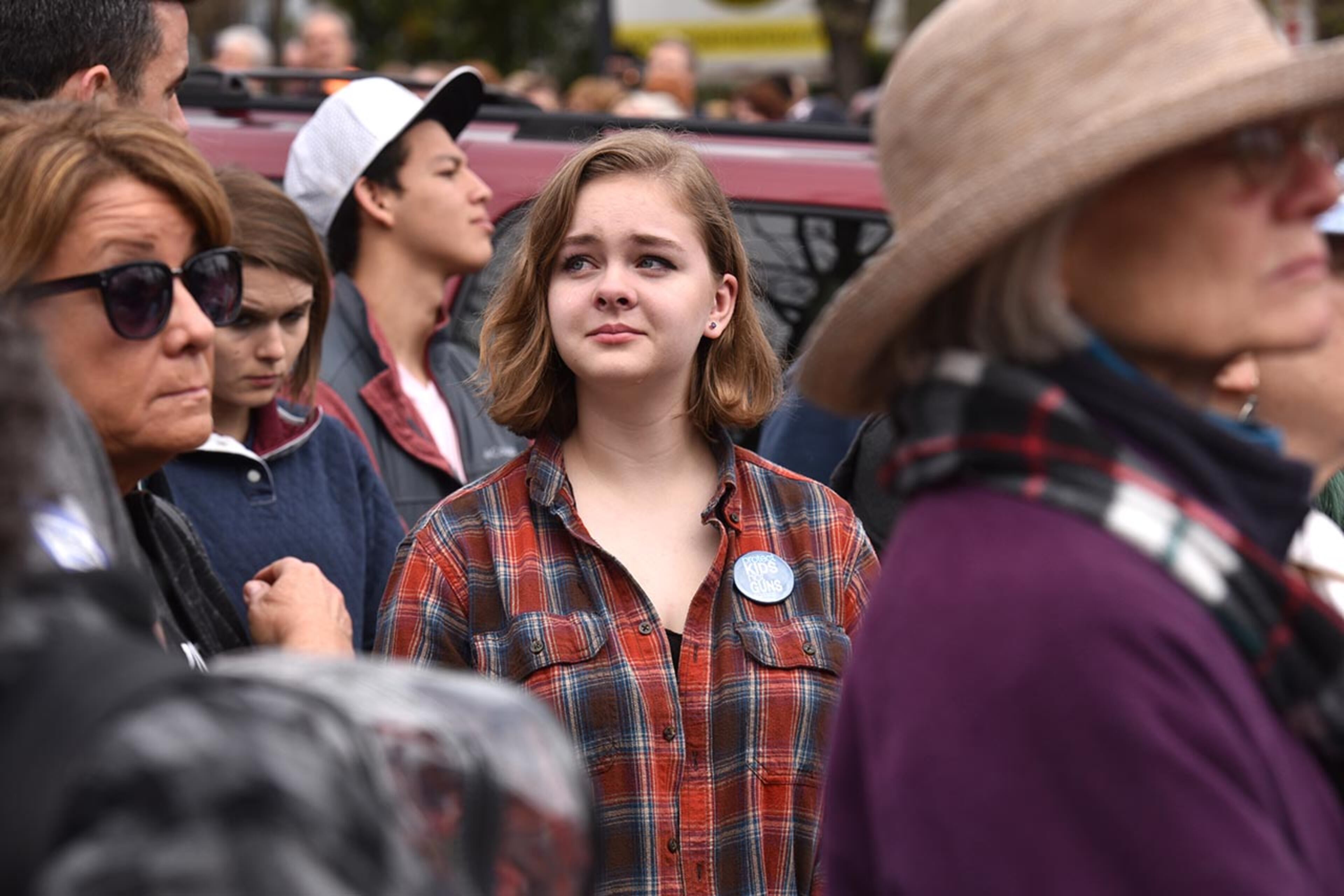 March 24, 2018 Atlanta - Protesters react during moment of silence with survivors at the Center for Civil and Human Rights before walking to Liberty Plaza on Saturday, March 24, 2018. Atlanta police estimated the crowd at near 30,000 for todayâÃôs March for Our Lives. People of all ages were drawn to one of the nationwide demonstrations in a movement begun by student survivors of last monthâÃôs mass killing in a Parkland, Fla., school. Some of those Florida students were among the speakers in Atlanta. HYOSUB SHIN / HSHIN@AJC.COM