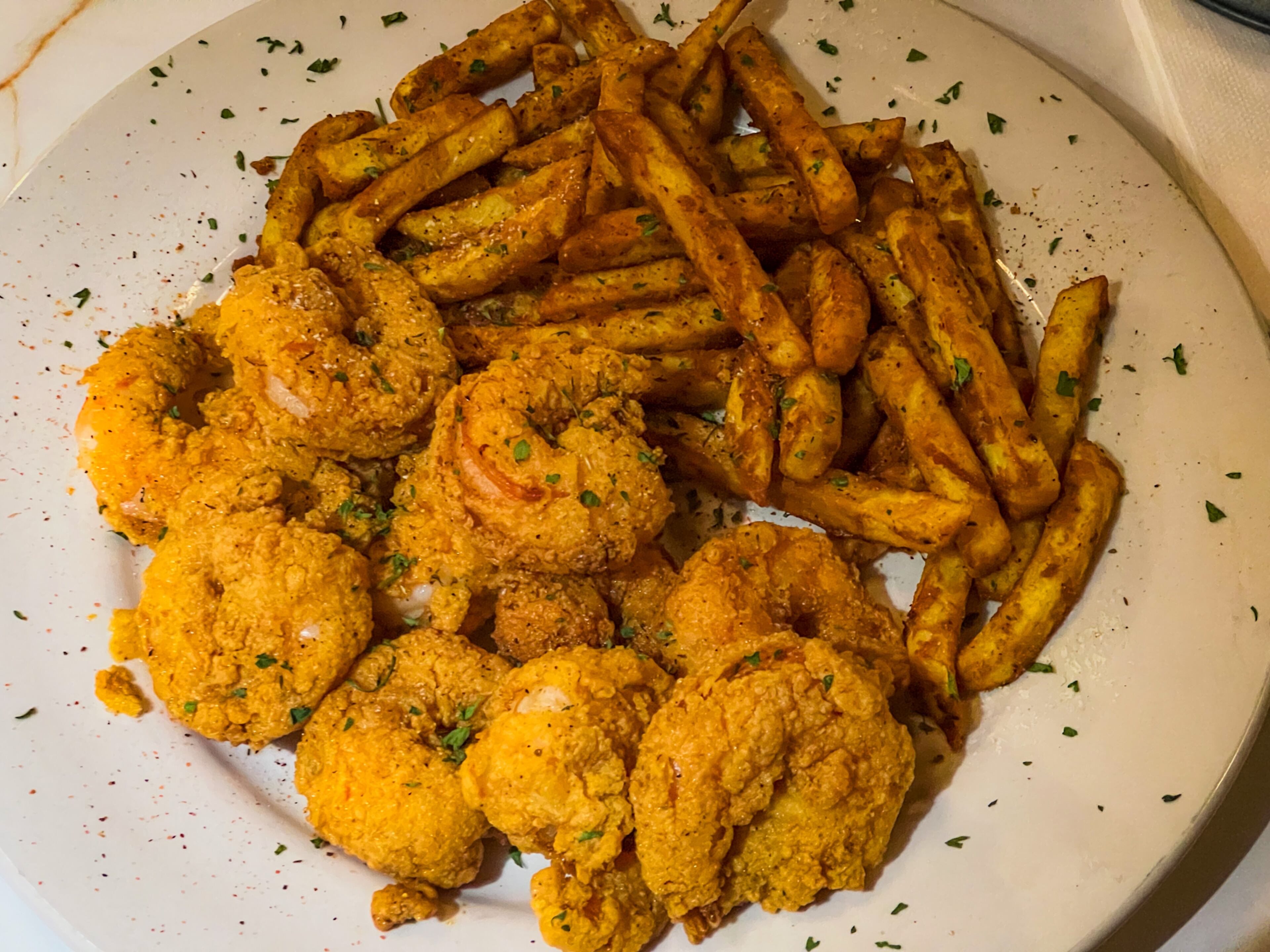 Fried shrimp comes with excellent french fries at the Seafood Menu. Henri Hollis/henri.hollis@ajc.com