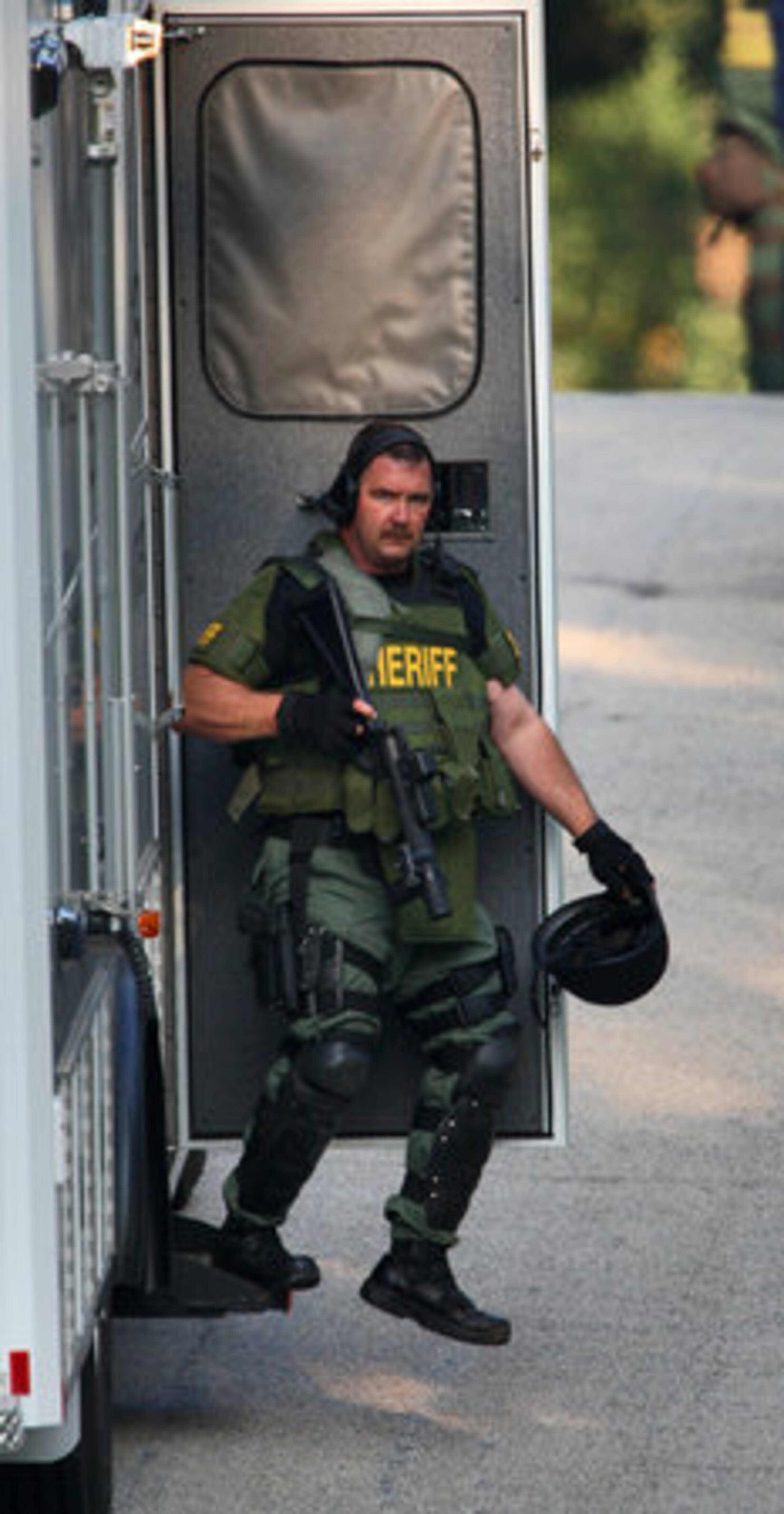 On Monday a Douglas County Sheriff's SWAT team member arrives on the scene where investigators with the U.S. Marshals Service attempted to serve a Paulding County warrant to David Spence for aggravated stalking. The standoff began around 5 a.m. and ended around 4:30 p.m.