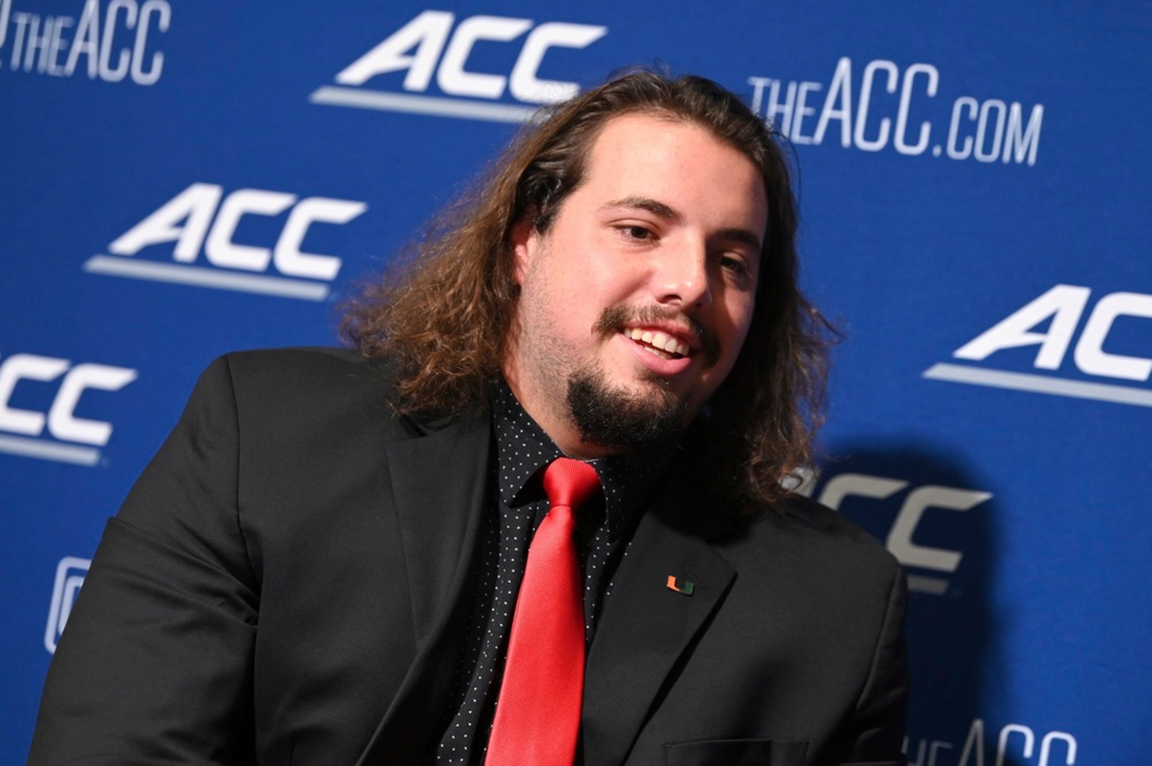 Miami offensive lineman Matt Lee speaks with reporters during the first day of the Atlantic Coast Conference college football media days in Charlotte, N.C., Tuesday, July 25, 2023. (Jeff Siner/The Charlotte Observer via AP)